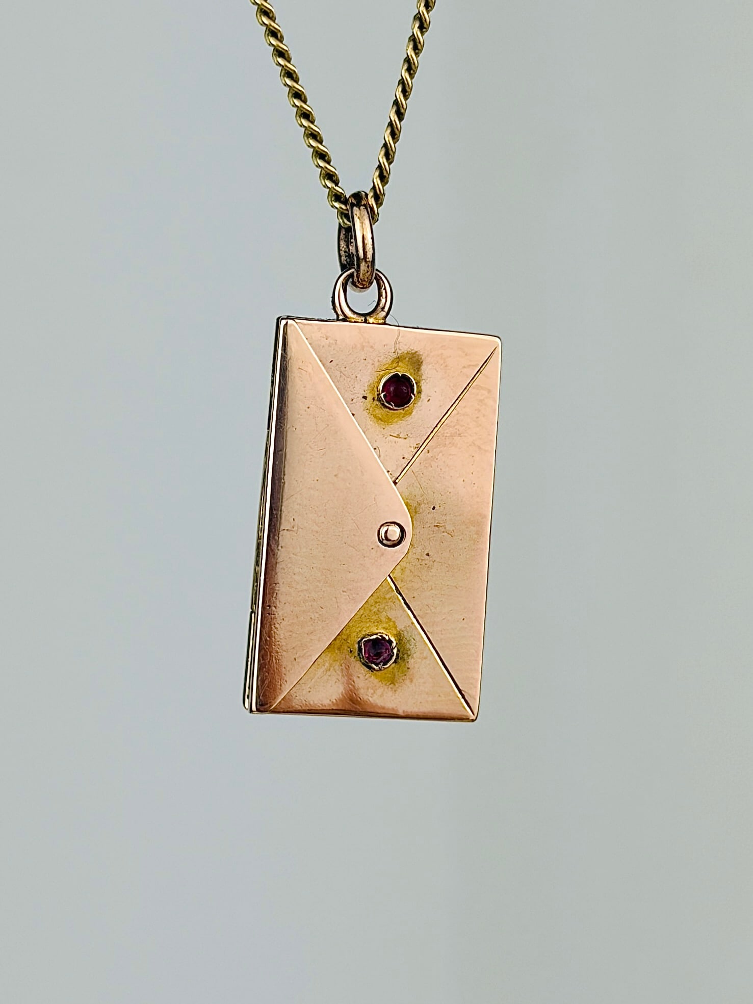 ANTIQUE OPENING ENVELOPE CHARM/PENDANT IN GOLD WITH RED PASTE STONES: ANTIQUE OPENING ENVELOPE CHARM/PENDANT IN GOLD WITH RED PASTE STONES Sweetest envelope charm that opens, perfect for carrying secret messages and keep sakes!