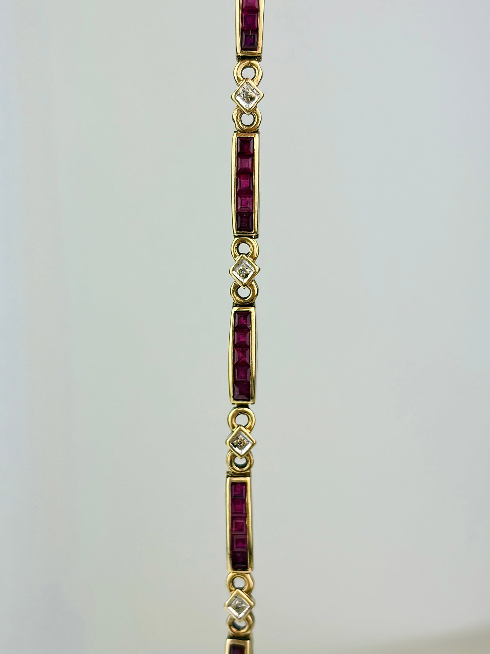 VINTAGE 9CT YELLOW GOLD RUBY AND DIAMOND LINE BRACELET: VINTAGE 9CT YELLOW GOLD RUBY AND DIAMOND LINE BRACELET A truly lovely bracelet!