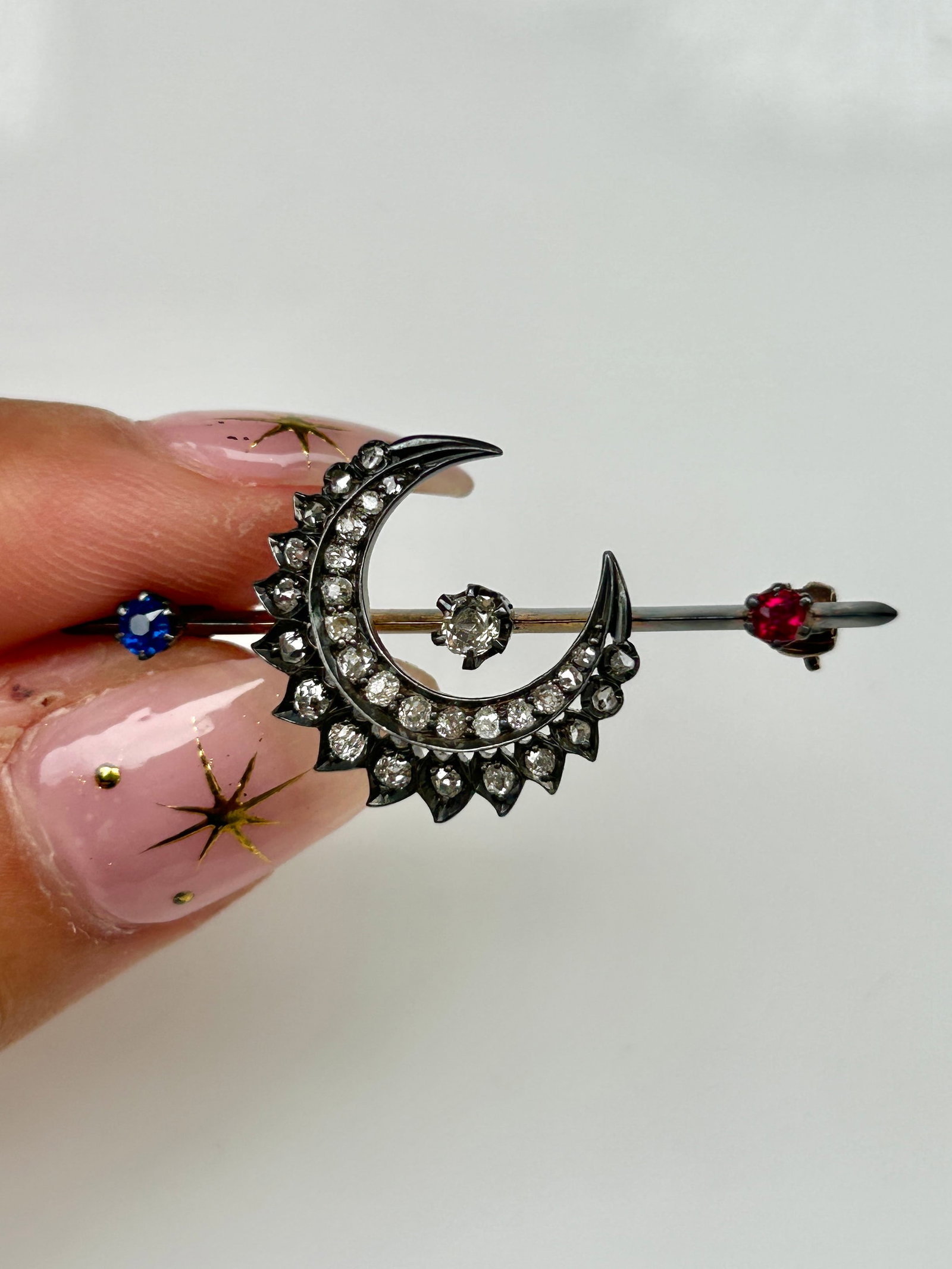 Antique double row diamond crescent brooch with diamond center and ruby and sapphire ends in gold (1 of 12)