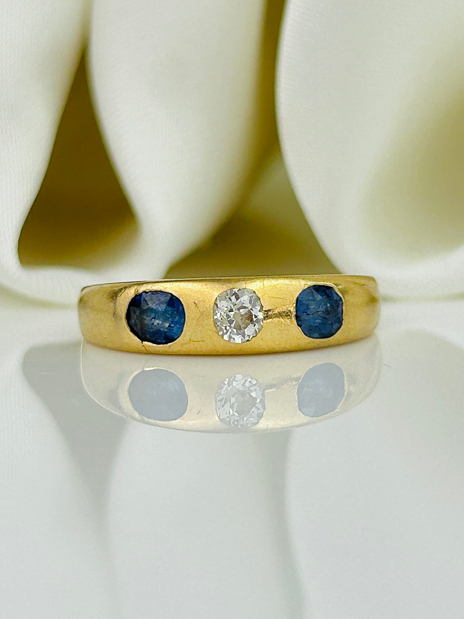 Antique 18ct Yellow Gold Sapphire and Diamond 3 Stone Ring: Antique 18ct Yellow Gold Sapphire and Diamond 3 Stone Ring Weight: 3.91g Size: UK M1/2, US 6.5, Width 4mm, Height off finger 3mm Materials: 18ct Yellow gold Hallmarks: Rubbed hallmark Condition: The