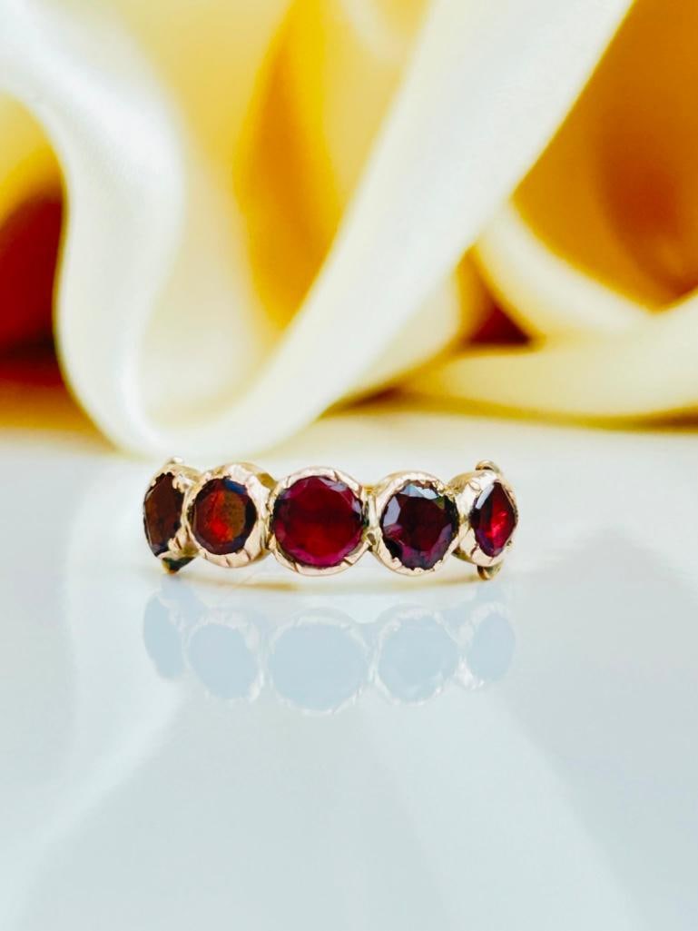 Georgian Flat Cut Garnet Half Hoop Ring in Gold: Georgian Flat Cut Garnet Half Hoop Ring in Gold 5 gorgeous glowing garnets measurements size UK P US 8 head of ring 18mm x 5mm weight 2g materials 