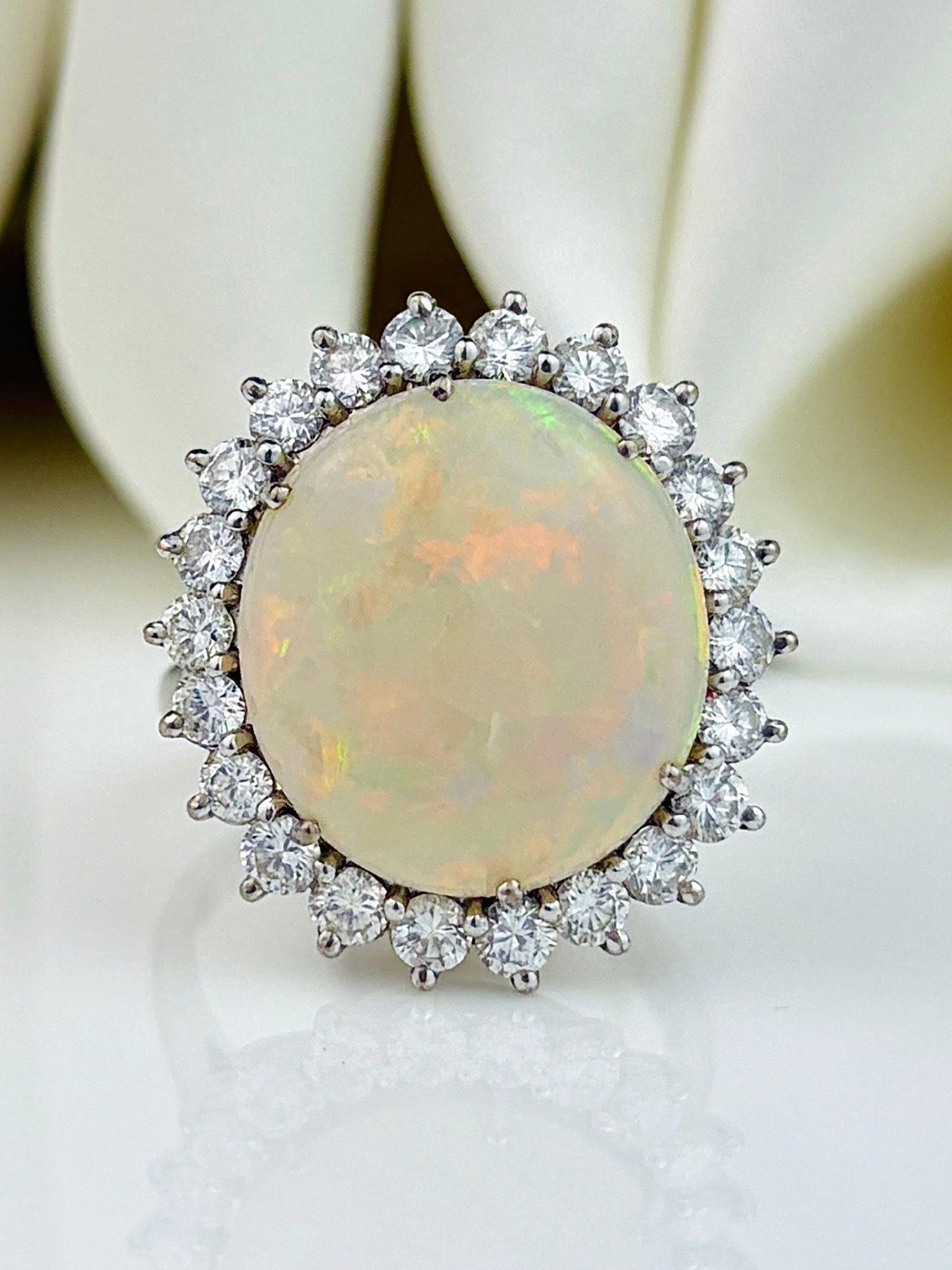 Vintage C.1979 18ct White Gold Opal and Diamond Halo Ring: Vintage C.1979 18ct White Gold Opal and Diamond Halo Ring