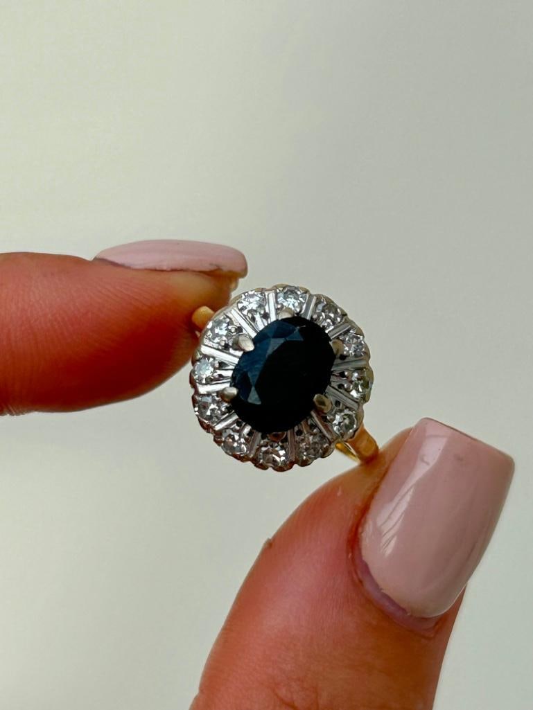 Vintage 9ct Yellow Gold Sapphire and Diamond Ring: Vintage 9ct Yellow Gold Sapphire and Diamond Ring gorgeous sapphire stone with diamonds surrounding measurements size UK N US 7 head of ring 14mm x 14mm weight 5.28g stamped 9ct