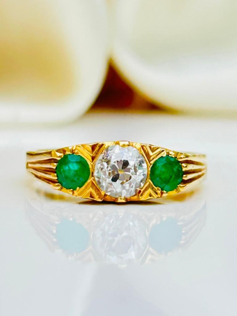 Chunky 18ct Yellow Gold Emerald and Diamond 3 Stone Ring: Chunky 18ct Yellow Gold Emerald and Diamond 3 Stone Ring 60pts Central Diamond, truly exceptional measurements size UK N US 7 head of ring 15mm x 5mm Weight: 4.81g s