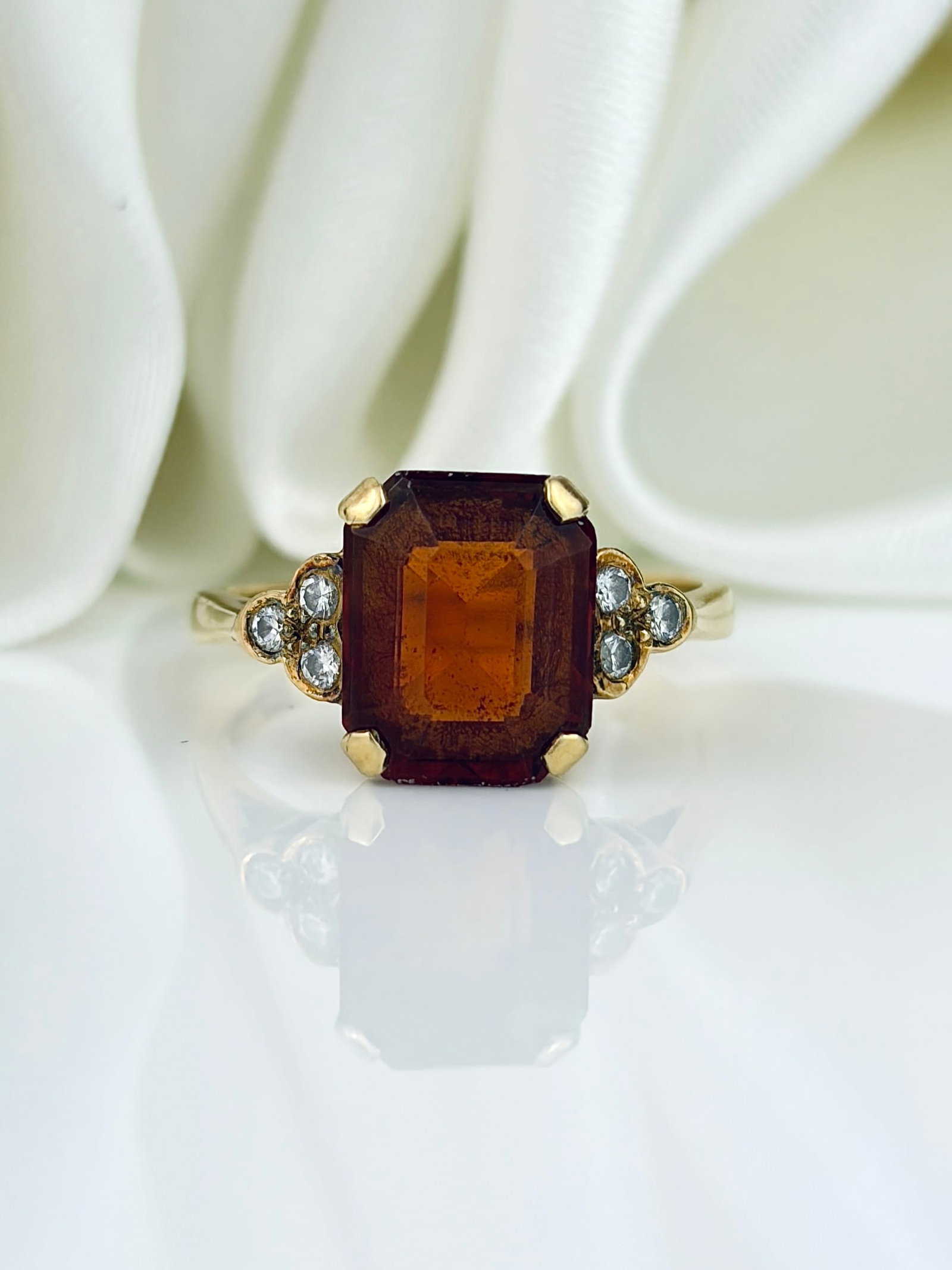 VINTAGE C.1989 18ct YELLOW GOLD FIRE OPAL AND DIAMOND COCKTAIL RING: VINTAGE C.1989 18CT YELLOW GOLD FIRE OPAL AND DIAMOND COCKTAIL RING Weight: 3.86g Size: UK L, US 6, Head of ring 9x7mm, height off finger 6mm Materials: 18ct gold Hallmarks: 18ct, London,