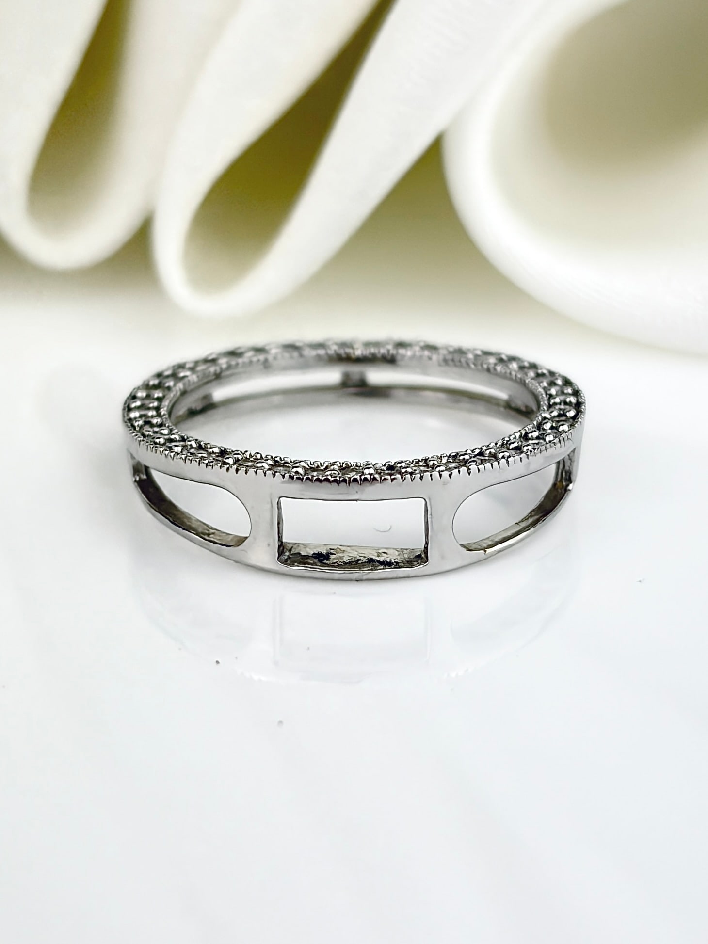 9CT WHITE GOLD OPEN WORK, DIAMOND TOPPED FULL ETERNITY RING: 9CT WHITE GOLD OPEN WORK, DIAMOND TOPPED FULL ETERNITY RING Weight: 1.6g Size: UK J, US 5.25, Width 5mm, height off finger 2mm Materials: 9ct gold, diamond Hallmarks: 9k stamp, KN makers