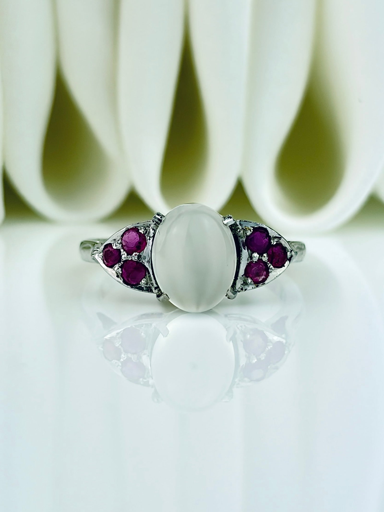 CABOCHON MOONSTONE AND RUBY RING IN SILVER: CABOCHON MOONSTONE AND RUBY RING IN SILVER Lovely ring!