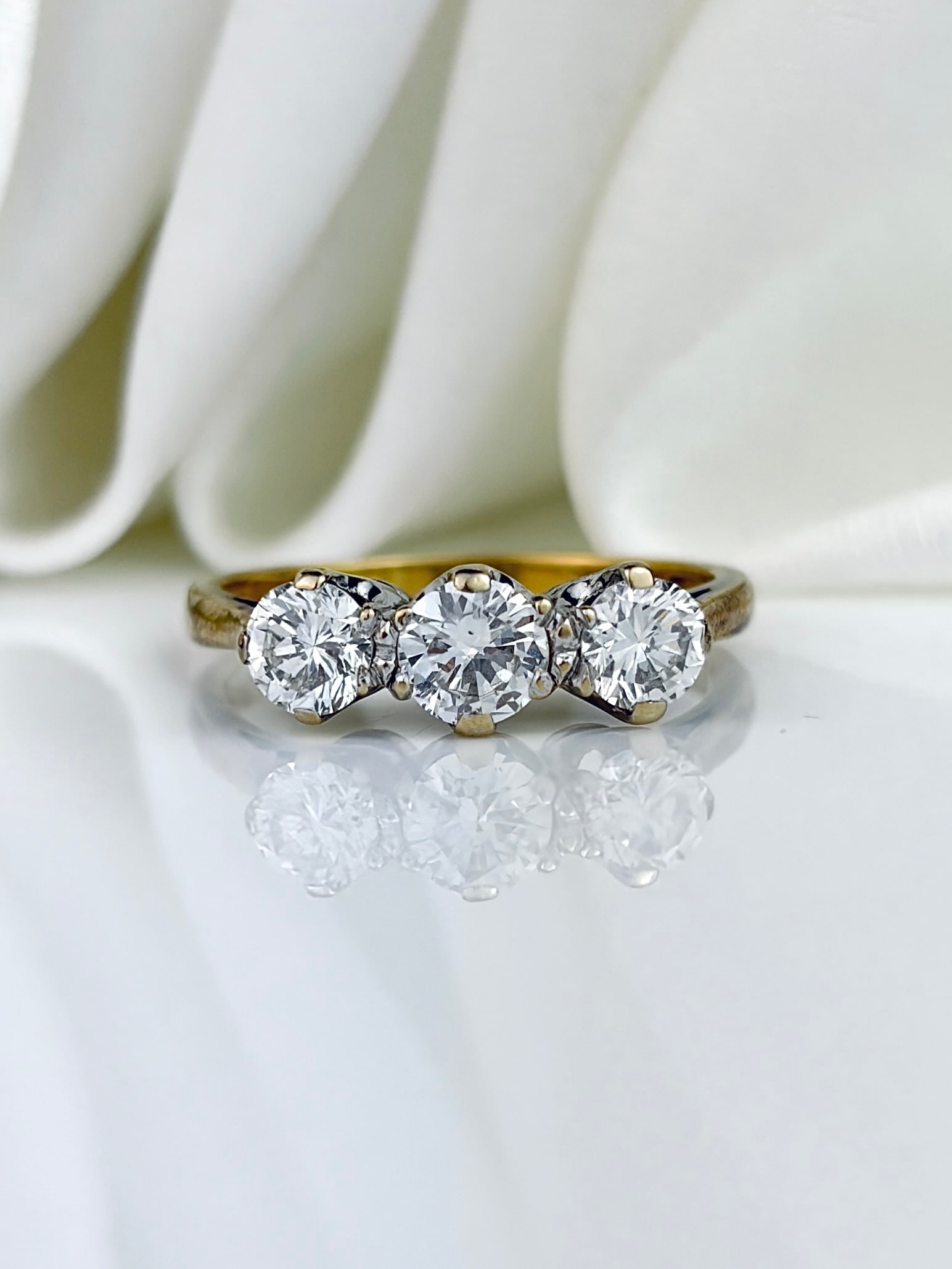 Chunky c.1981 18ct Yellow Gold And Platinum Diamond 3 Stone Ring Totalling Approx 1 Carat: Chunky 18ct Yellow Gold And Platinum Diamond 3 Stone Ring Totalling Approx 1 Carat Bright Clean Diamonds Center Diamond approx 40pts , 30pts Either side A classic diamond three stone ring,