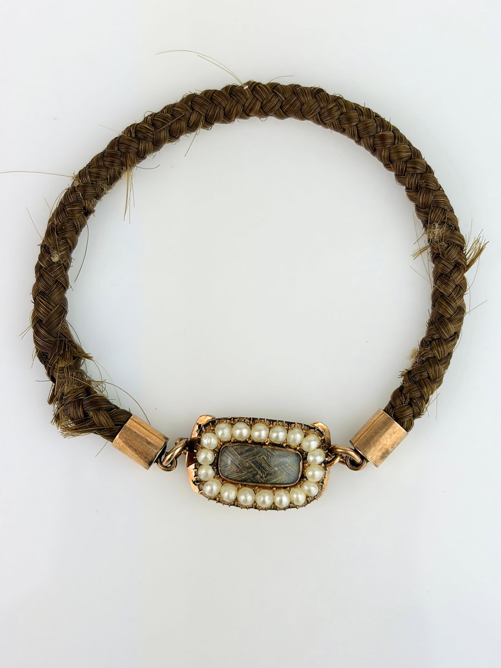 c.1792 Georgian Era 9ct Gold Pearl Locket, Hair Bracelet: c.1792 Georgian Era 9ct Gold Pearl Locket, Hair Bracelet Beautiful braided hair bracelet with a gold pearl locket, with the inscription 'M. Mary Ob 7th Sep 1792 at 77'