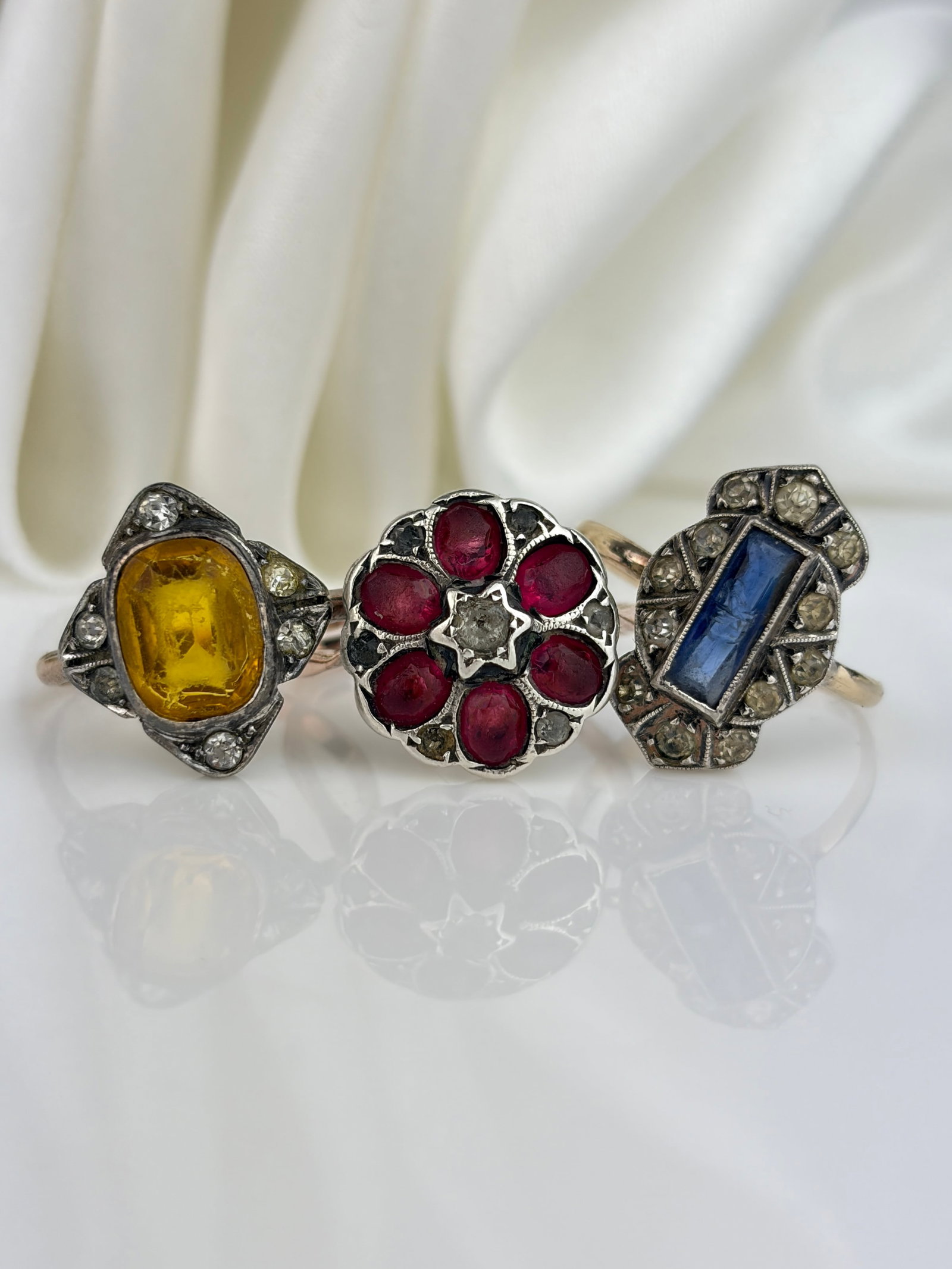 Mixed Lot - 3x 9ct Gold and Silver Gemstone Rings: Mixed Lot - 3x 9ct Gold and Silver Gemstone Rings Sapphire is chipped - all stones slightly rubbed.
