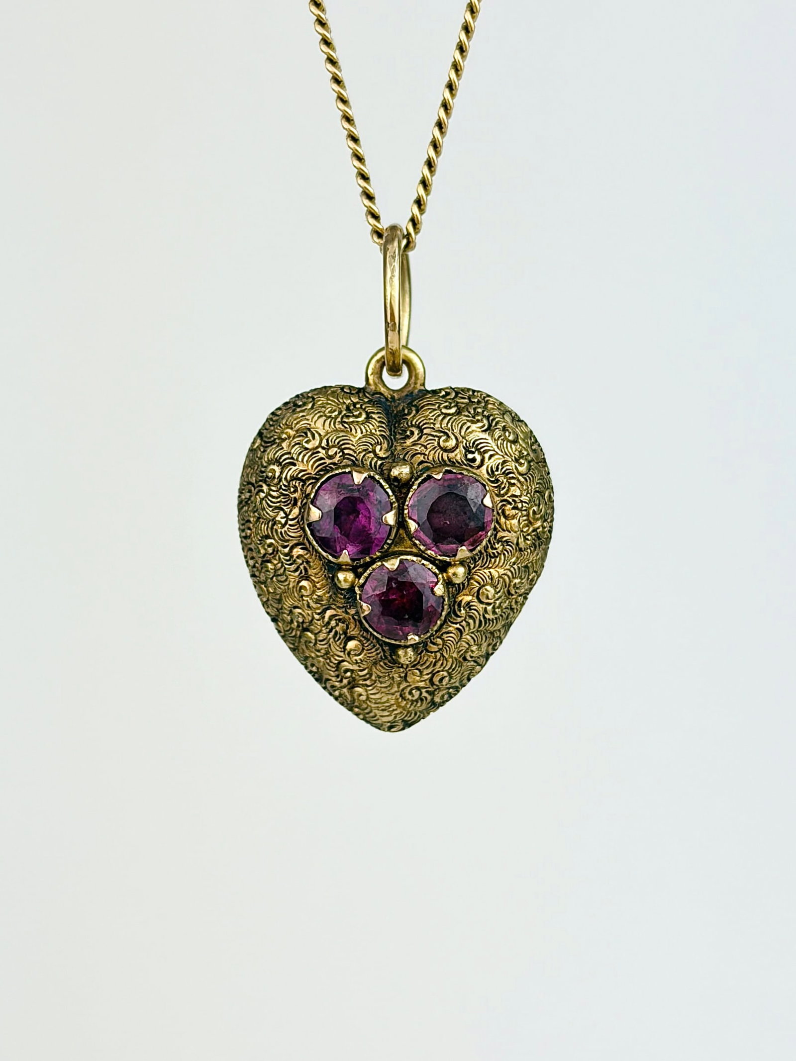 ANTIQUE ENGRAVED HEART LOCKET PENDANT WITH AMETHYSTS IN GOLD: ANTIQUE ENGRAVED HEART LOCKET PENDANT WITH AMETHYSTS IN GOLD Absolutely stunning heart with gorgeous details and a locket back!