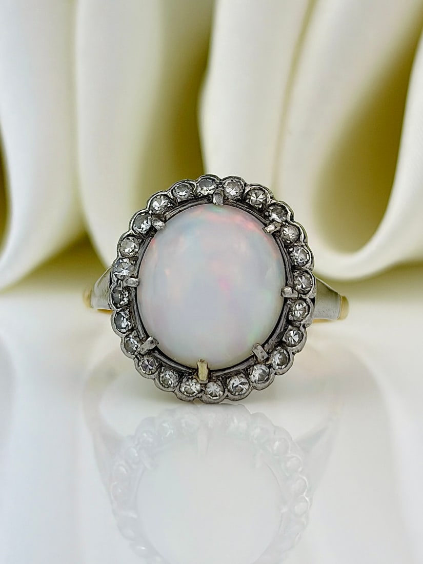vintage 18ct gold opal and diamond halo ring: vintage 18ct gold opal and diamond halo ring Incredible chunky opal surrounded by a halo of sparkling diamonds!
