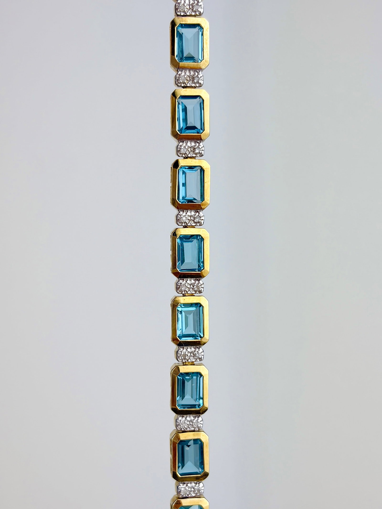 LOVELY 10CT YELLOW GOLD BLUE TOPAZ AND DIAMOND LINE BRACELET: LOVELY 10CT YELLOW GOLD BLUE TOPAZ AND DIAMOND LINE BRACELET Such a beautiful line bracelet!