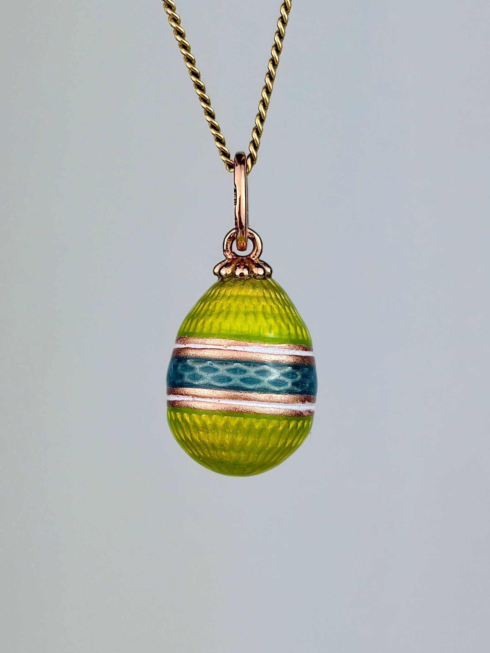 WONDERFUL BLUE AND GREEN 14CT GOLD RUSSIAN EGG PENDANT: WONDERFUL BLUE AND GREEN 14CT GOLD RUSSIAN EGG PENDANT Such bright, beautiful colours Weight: 2.6g Size: 23x11mm Materials: 56 zolotniks / 14CT GOLD Hallmarks: See photo Condition: