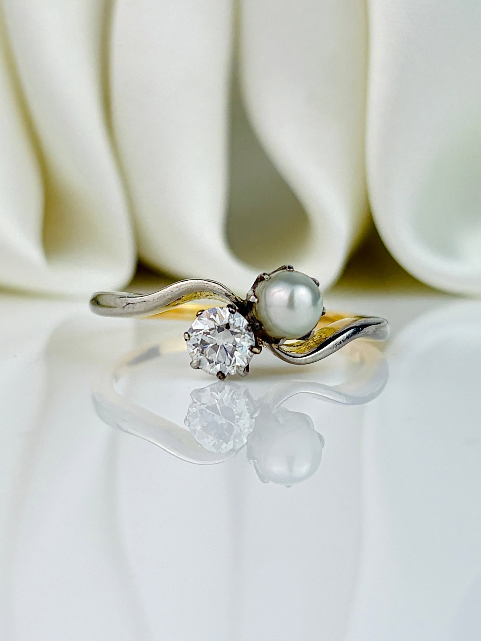 Antique 18ct Yellow Gold .40pt Diamond and Pearl Moi et Toi 2 Stone Twist Ring: Antique 18ct Yellow Gold .40pt Diamond and Pearl Moi et Toi 2 Stone Twist Ring Gorgeous ring! Weight: 7.61g Size: UK Q, US 8.5, Face of ring 7x6mm, Height off finger 5.5mm Materials: 18ct yellow gold