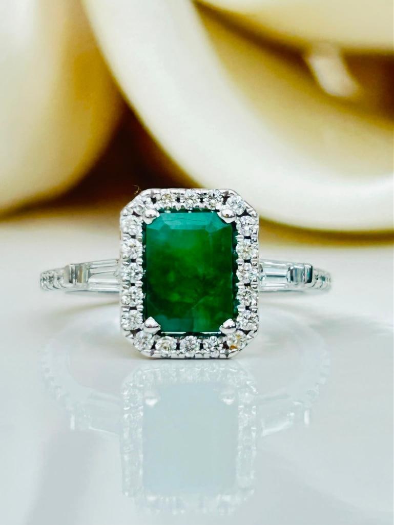 *Vintage 14K White Gold Emerald and Diamond Ring: Vintage 14K White Gold Emerald and Diamond Ring Delightful Emerald and Diamond halo ring with lovely baguette cut diamond shoulders set entirely in 14K White Gold. measurements size UK K