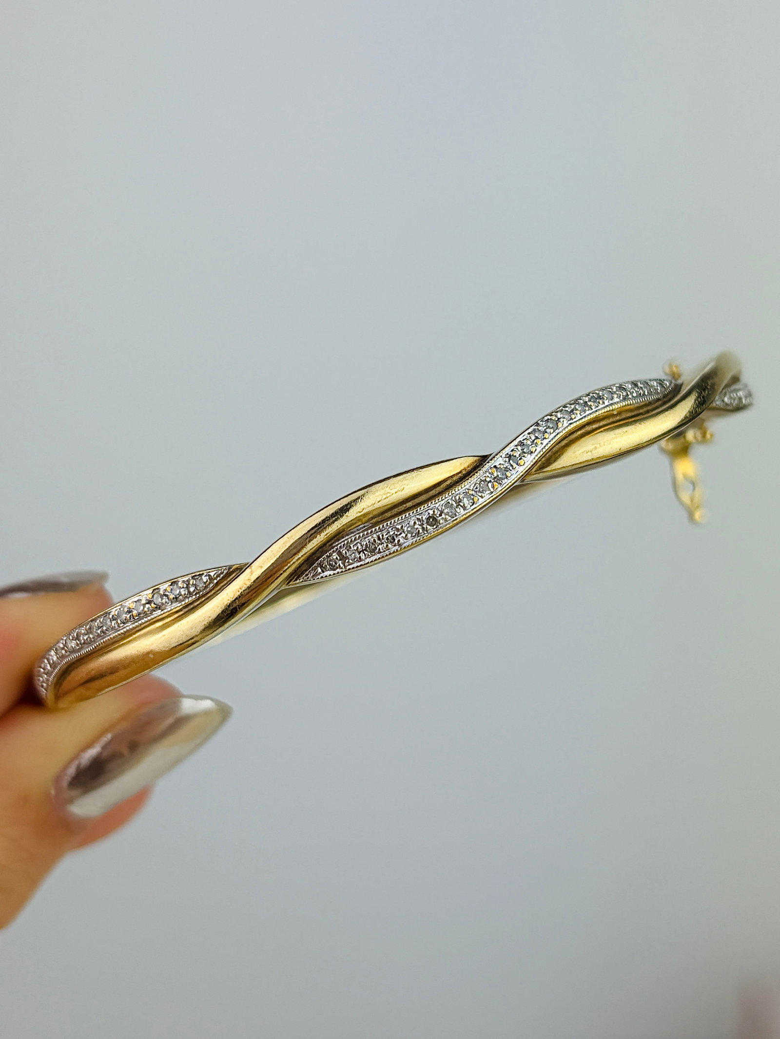 Wonderful Heavy 9ct Gold and Diamond Twisted Bangle Bracelet: Wonderful Heavy 9ct Gold and Diamond Twisted Bangle Bracelet Capturing design that looks amazing on its own, or in a stack! Weight: 12.24g Size: Inner circumference 18.5cm, Width 5mm, depth