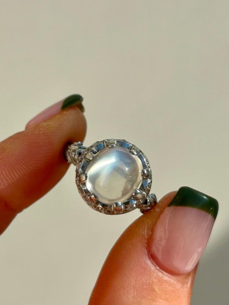 Cabochon Moonstone and Diamond White Gold Statement Ring: Cabochon Moonstone and Diamond White Gold Statement Ring The most incredible cabochon moonstone, truly excellent! measurements: size M1/2 head of ring 14mm x 14mm weight 6.65g materials: white