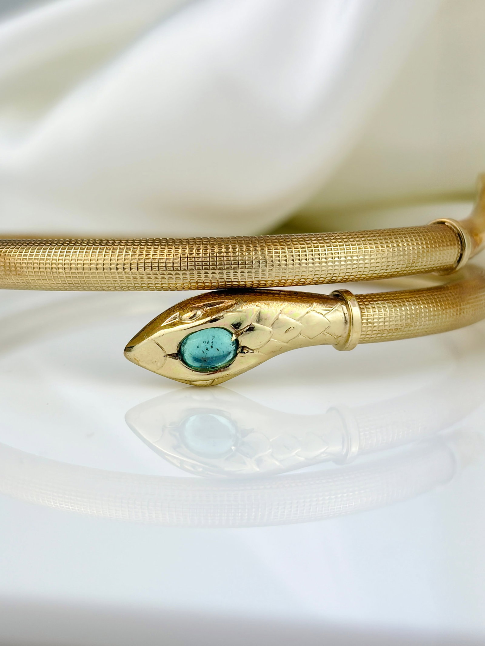 VINTAGE COILED SNAKE BANGLE WITH BLUE FOILED PASTE HEAD IN ROLLED GOLD - 10
