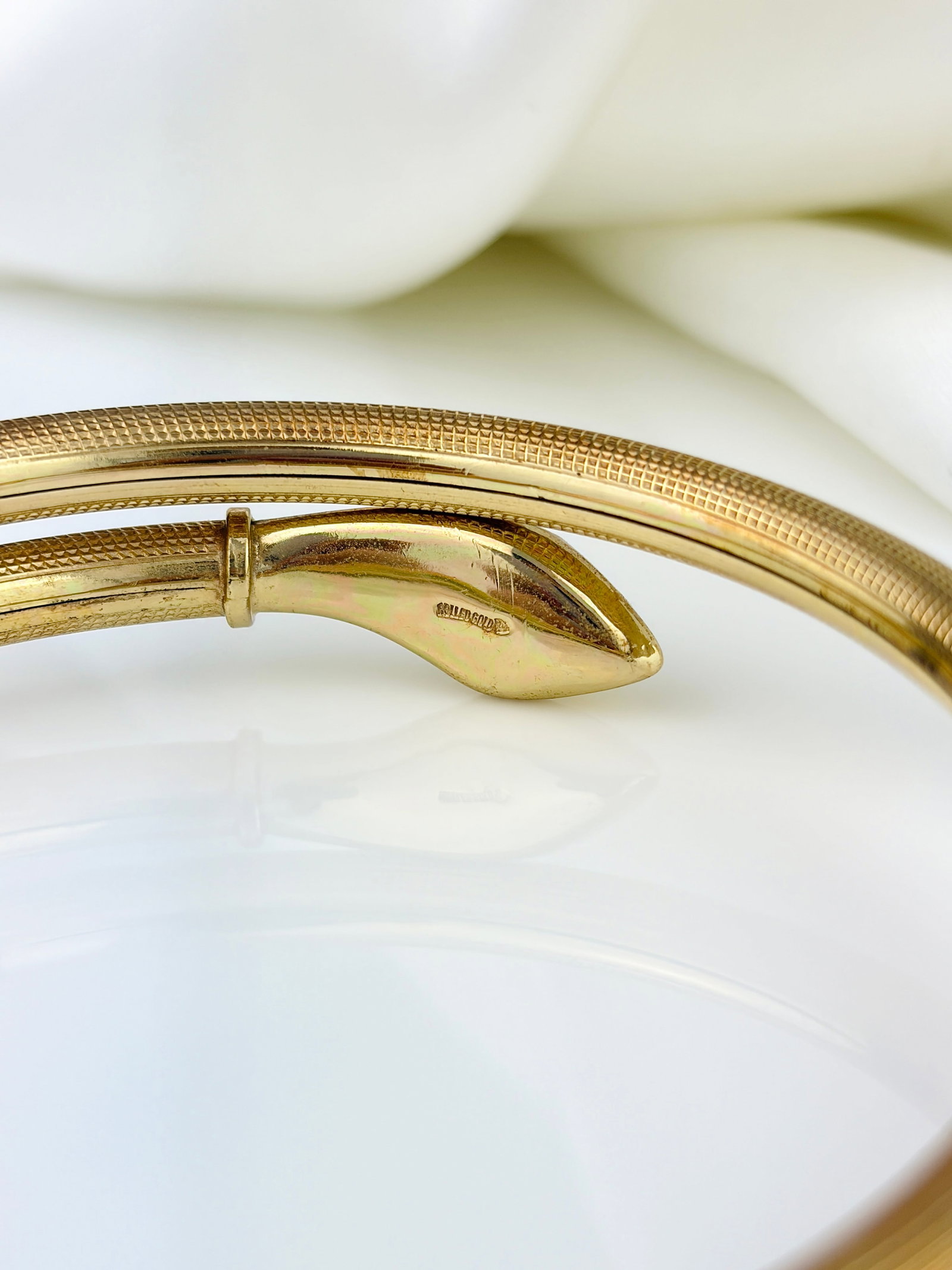 VINTAGE COILED SNAKE BANGLE WITH BLUE FOILED PASTE HEAD IN ROLLED GOLD - 9