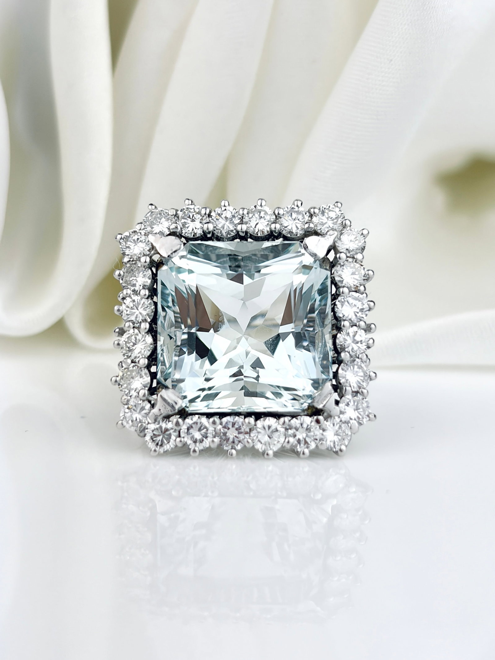 Outstanding Aquamarine And Diamond Square Cocktail Ring Set In Platinum: Outstanding Aquamarine And Diamond Square Cocktail Ring Set In Platinum An absolute show stopper, featuring a giant square cut aquamarine surrounded by a halo of diamonds! A small size!