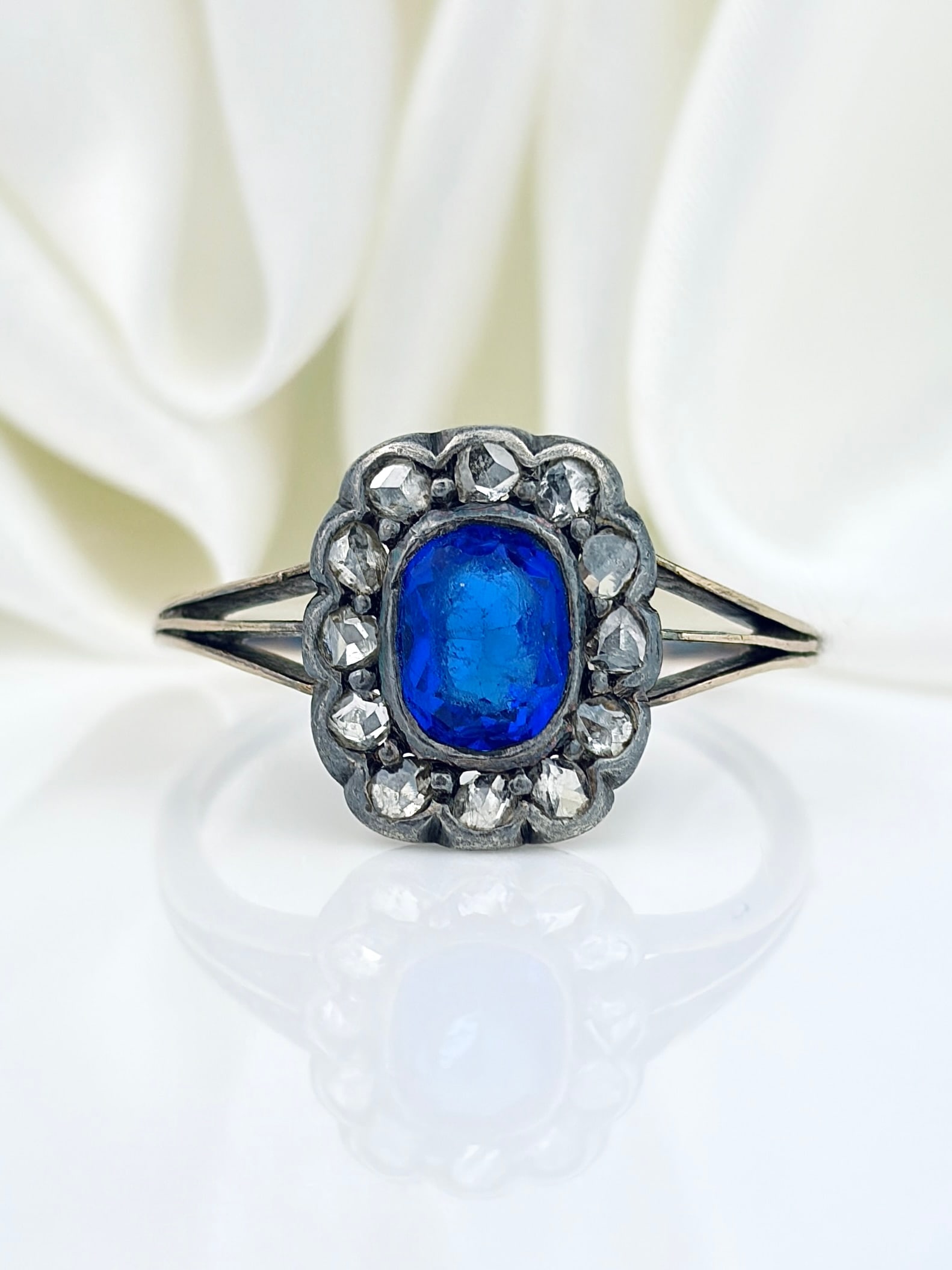 ANTIQUE GOLD AND SILVER ROSE CUT DIAMOND AND BLUE PASTE HALO RING: ANTIQUE GOLD AND SILVER ROSE CUT DIAMOND AND BLUE PASTE HALO RING