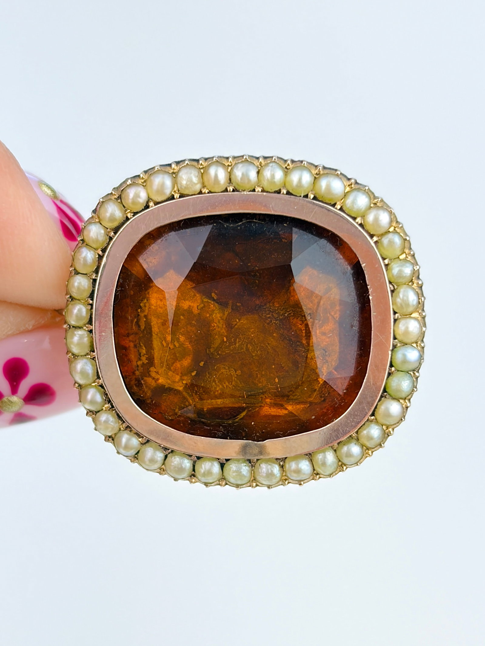 Antique Foiled Back Yellow Paste and Pearl Brooch in Gold: Antique Foiled Back Yellow Paste and Pearl Brooch in Gold Inscription says 'Betty. 1932. ob 20th Aug 1811.' Weight: 6.82g Size: 25x23mm Materials: Gold Hallmarks: None Present 