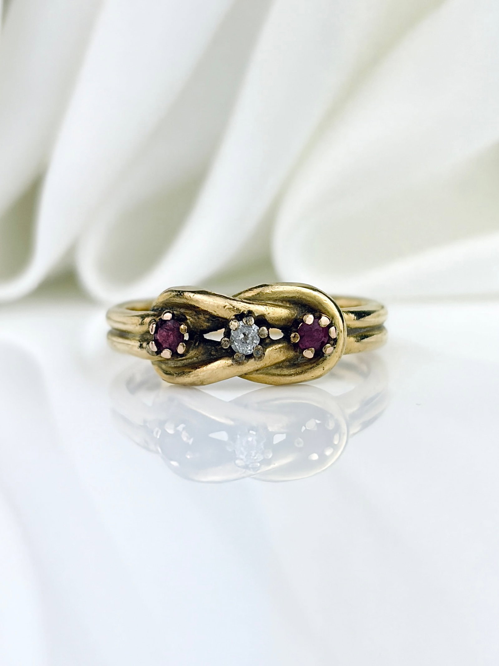 Heavy Antique 18ct Yellow Gold Ruby And Diamond 3 Stone Twist Ring: Heavy Antique 18ct Yellow Gold Ruby And Diamond 3 Stone Twist Ring A lovely, unique three stone ruby and diamond ring with a knot detail!