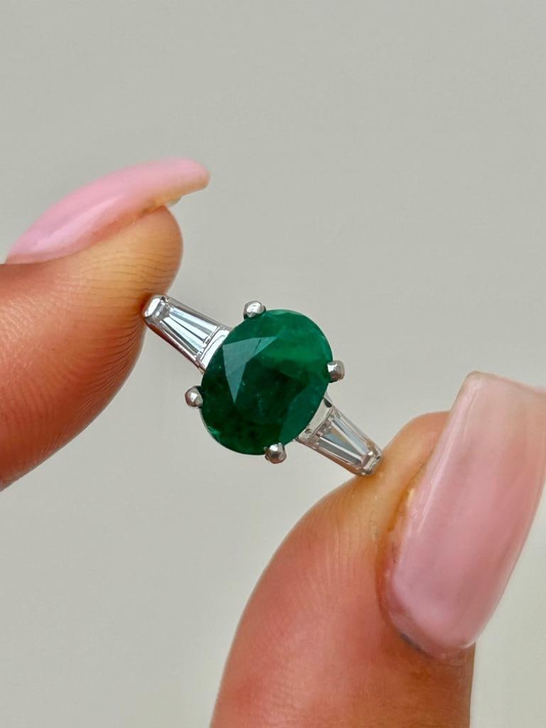 Wonderful Platinum Emerald Ring with Baguette Diamond Shoulders: Wonderful Platinum Emerald Ring with Baguette Diamond Shoulders the most beautiful large emerald stone with sweet diamond shoulders measurements size UK J US 51/4 head 