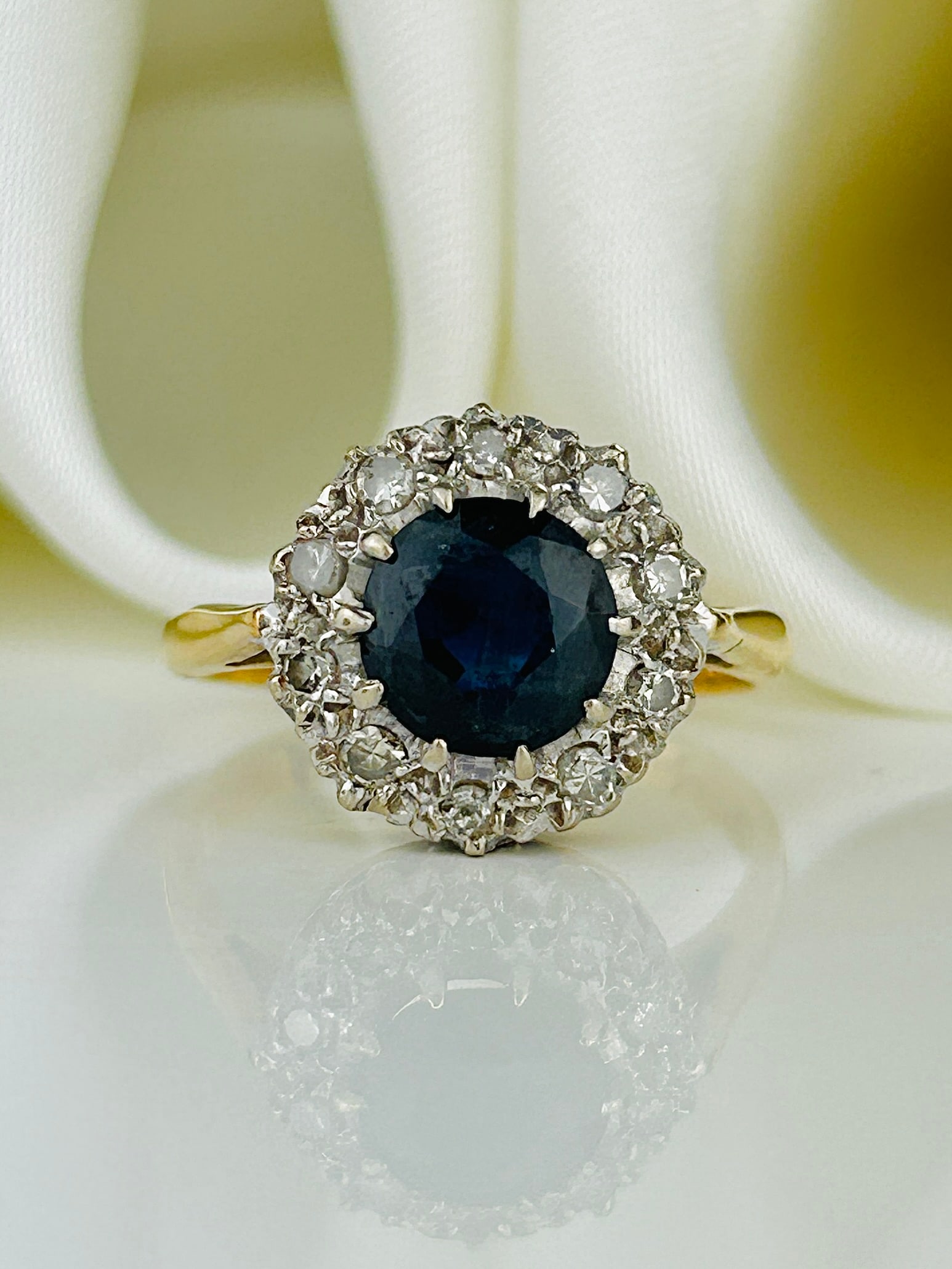 Antique Sapphire and Diamond Cluster Ring in 18ct Gold: Antique Sapphire and Diamond Cluster Ring in 18ct Gold Weight: 5.03g Size: UK N, US 7, Face of ring 12x12mm, Height off finger 6mm Materials: 18ct gold Hallmarks: Rubbed full hallmark, 18ct
