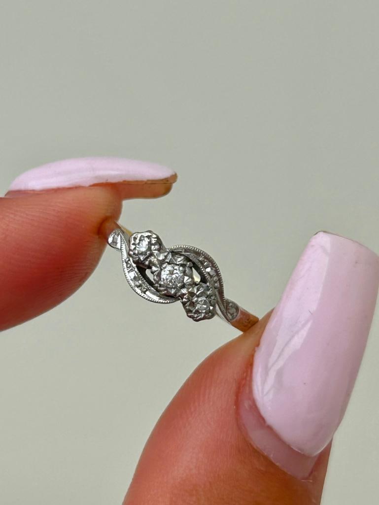 18ct Yellow Gold and Platinum Diamond 3 Stone Twist Ring: 18ct Yellow Gold and Platinum Diamond 3 Stone Twist Ring beautiful diamond twist, truly wonderful! measurements size UK L US 6 head of ring 10mm x 6mm weight 2.47g s