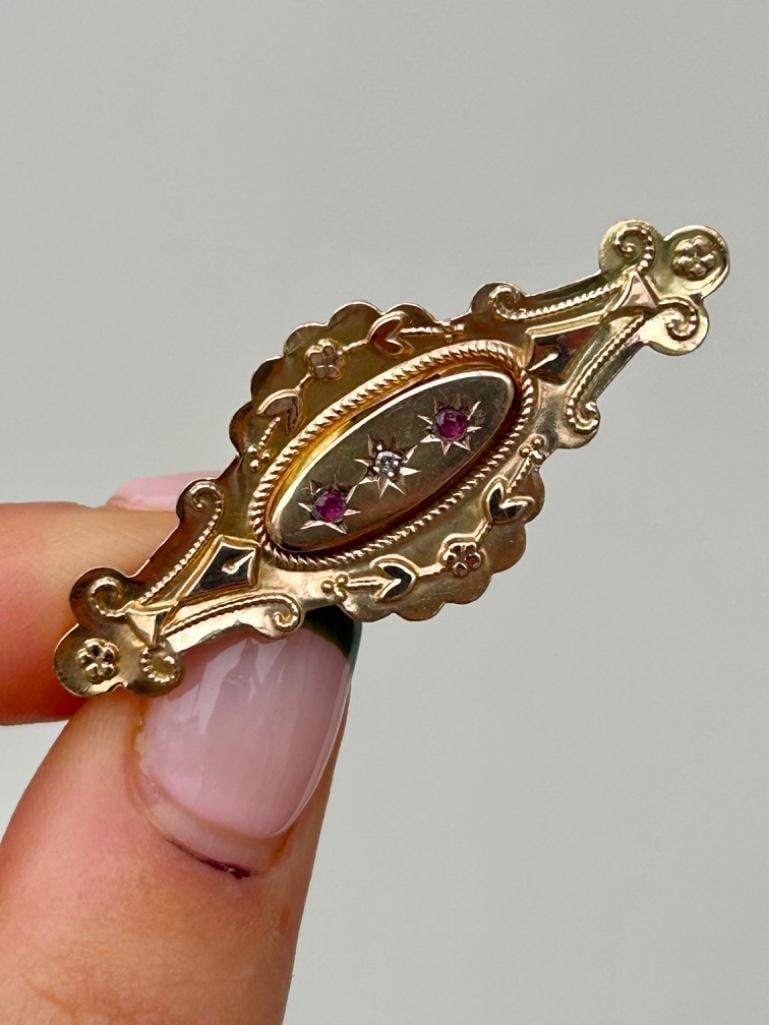 Antique Yellow Gold Ruby and Diamond Locket Back Star Bar Brooch: Antique gold ruby and diamond star brooch wonderful ruby & diamond brooch! measurements: length 45mm width 18mm weight 2.45g stamped 9ct condition: see photos office u