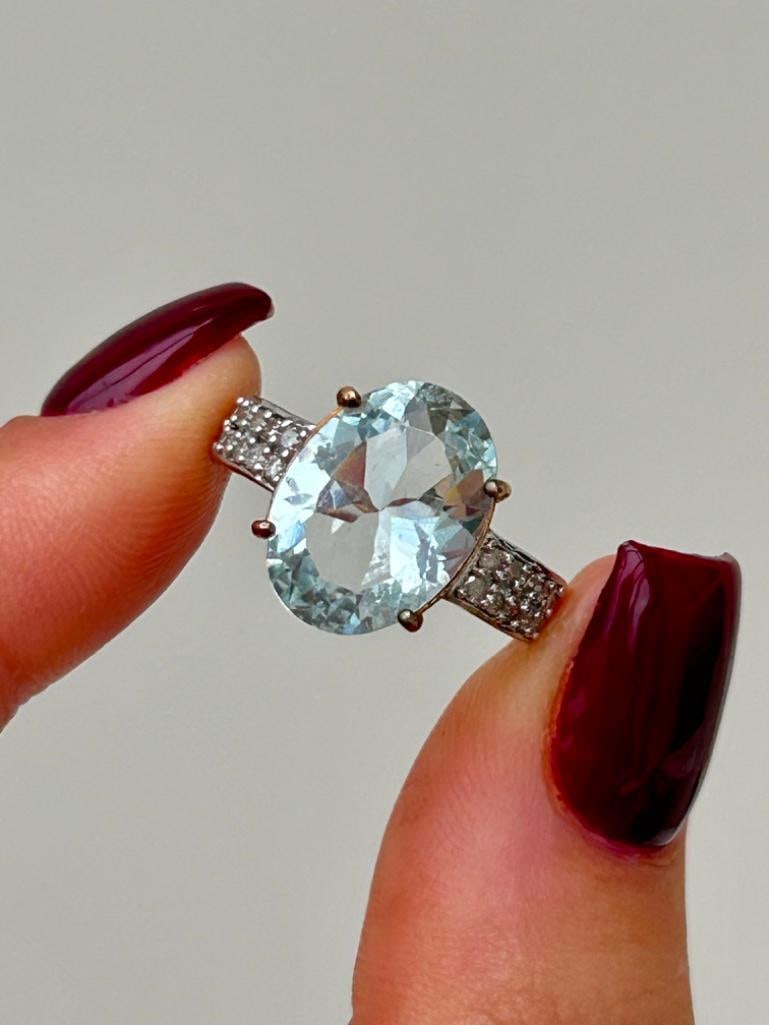 Sweet 9ct Gold Aquamarine and Diamond Ring: Sweet 9ct Gold Aquamarine and Diamond Ring beautiful aquamarine stone with sweet diamond shoulders measurements size UK N1/2 US 7 head of ring 13mm x 10mm weight 3.63g