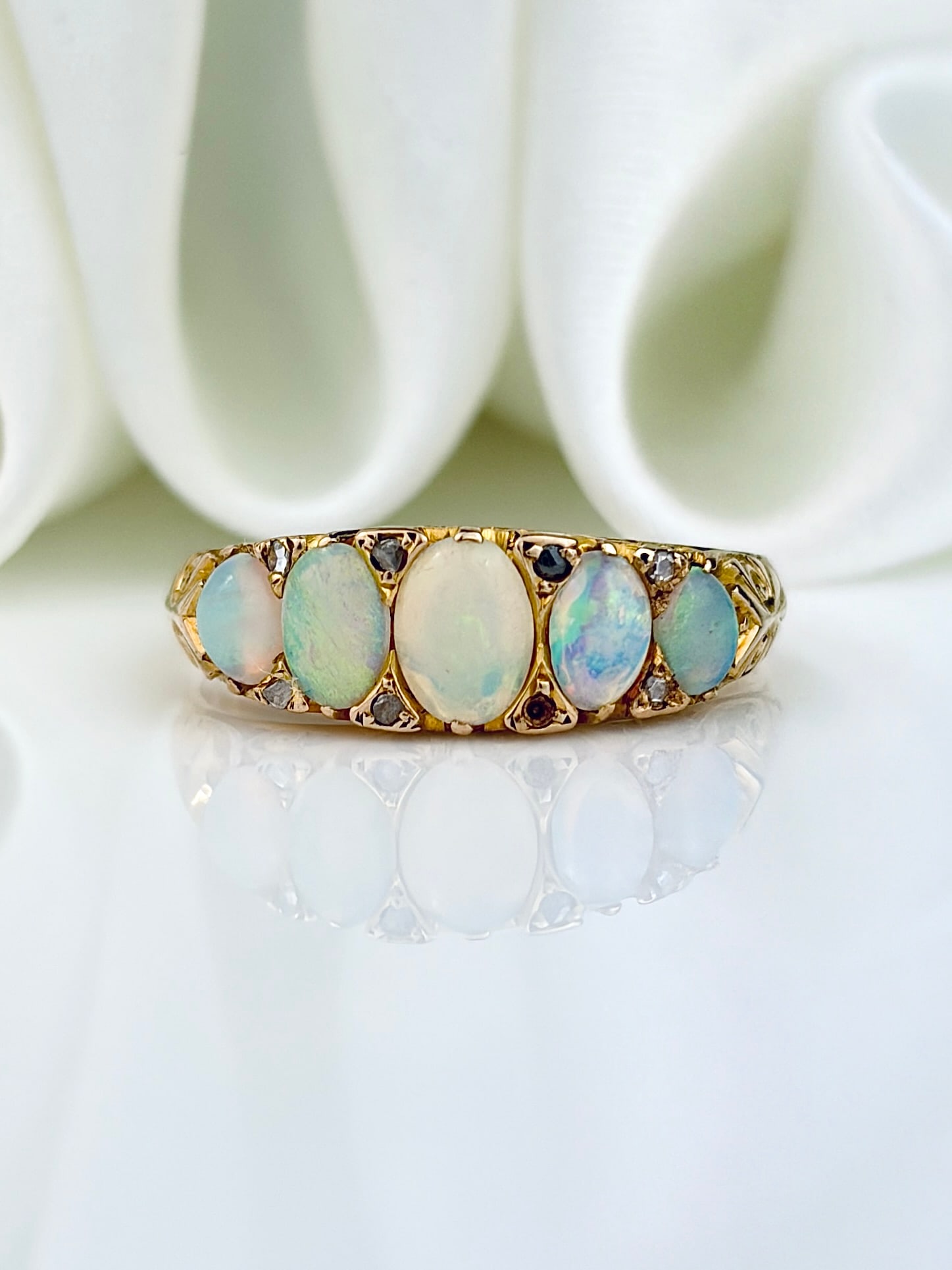 ANTIQUE 18CT YELLOW GOLD OPAL 5 STONE RING WITH DIAMOND POINTS: ANTIQUE 18CT YELLOW GOLD OPAL 5 STONE RING WITH DIAMOND POINTS Gorgeous ring! Weight: 2.73g Size: UK L1/2, US 6.25, Width 5mm, height off finger 3mm Materials: 18ct gold Hallmarks: Faded