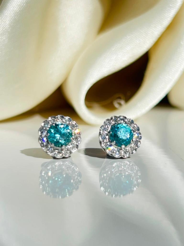*Art Deco Blue Zircon and Diamond 18 Carat White Gold Cluster Stud Earrings: Art Deco Blue Zircon and Diamond 18 Carat White Gold Cluster Stud Earrings The gorgeous blue of these zircon stones is perfectly complimented by the halo of sparkling diamonds surrounding them.