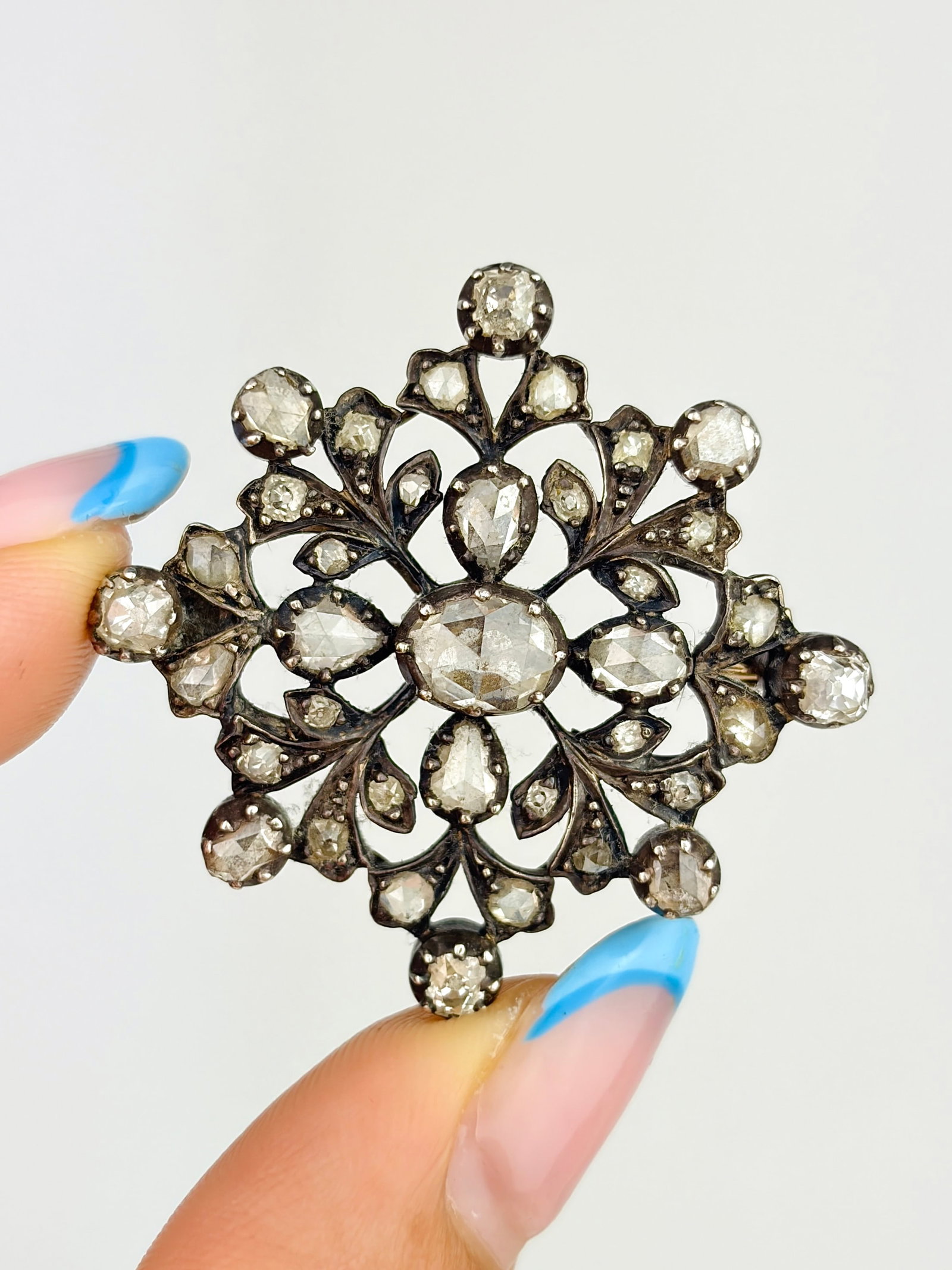 Victorian Antique Rose Cut Diamond Floral Brooch: Victorian Antique Rose Cut Diamond Floral Brooch A striking brooch with a collection of incredible rose cut diamonds!
