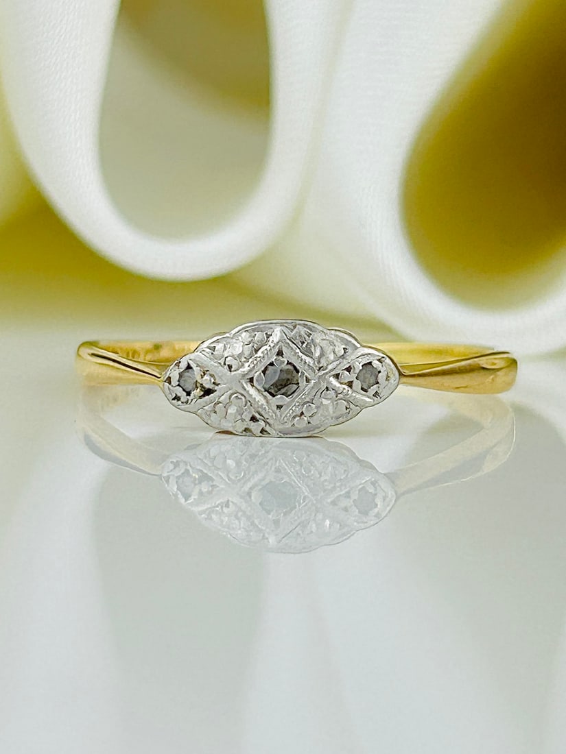Antique 18ct Gold and Platinum Diamond 3 Stone Ring: Antique 18ct Gold and Platinum Diamond 3 Stone Ring Weight: 1.64g Size: UK Q, US 8.5, Face of ring 5x9mm, Height off finger 2mm Materials: 18ct gold and platinum Hallmarks: 18ct plat