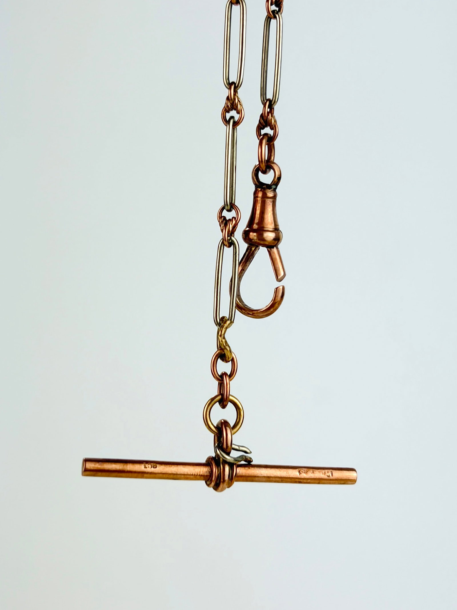 Chain Extender with Tbar in 9ct Rose and White Gold: Chain Extender with Tbar in 9ct Rose and White Gold Weight: 4.55g Size: length 12.5cm, width2.2mm Materials: 9ct gold Hallmarks: 9ct stamps Condition: very good overall condition. Some