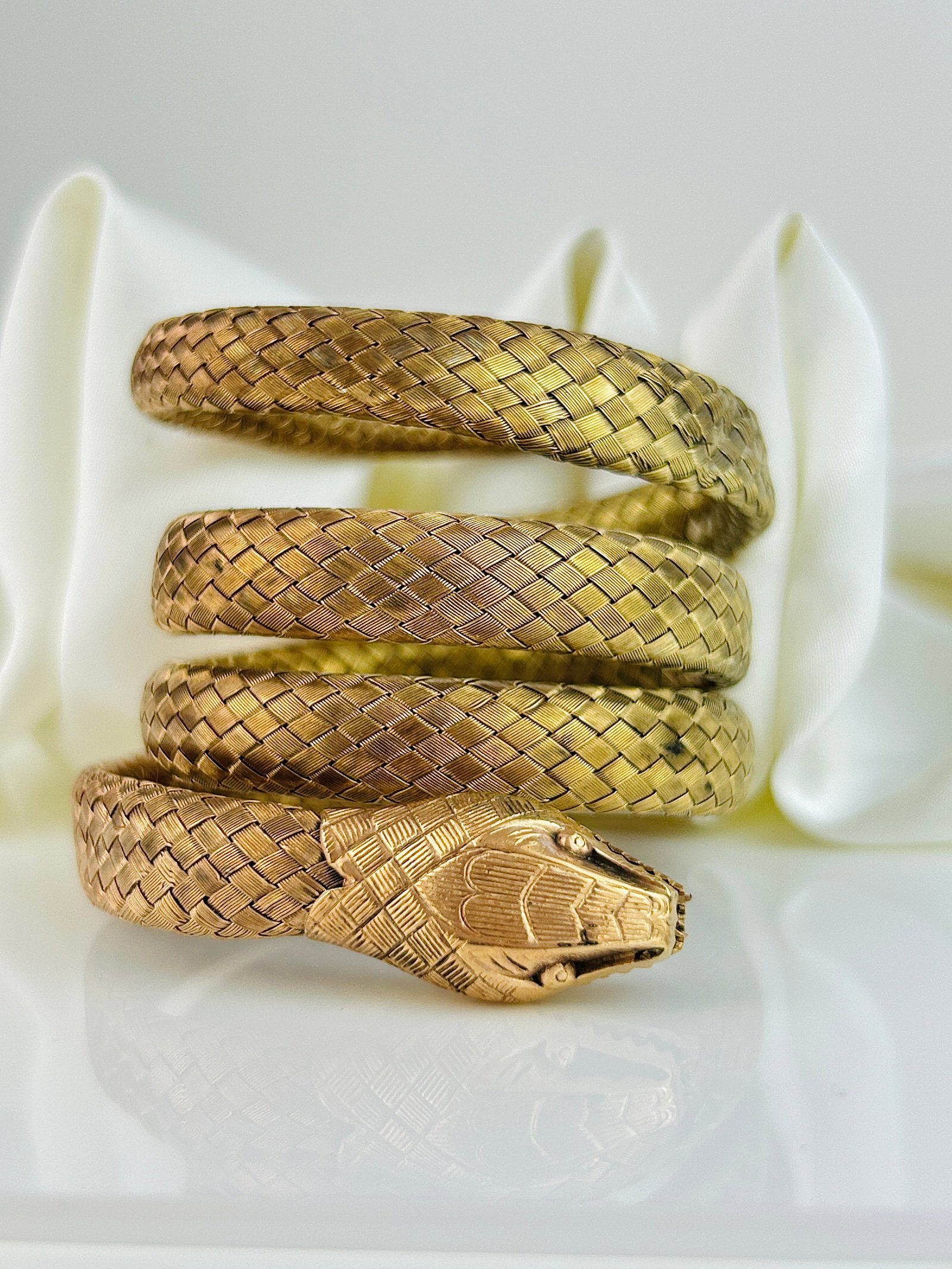 Gilt Quadruple Coiled Snake Bangle Bracelet: Gilt Quadruple Coiled Snake Bangle Bracelet Weight: 40.52g Size: Bracelet Eaxpands, so no specific size. Width of snake 10mm Materials: Gilt metal Condition: The overall condition is very good