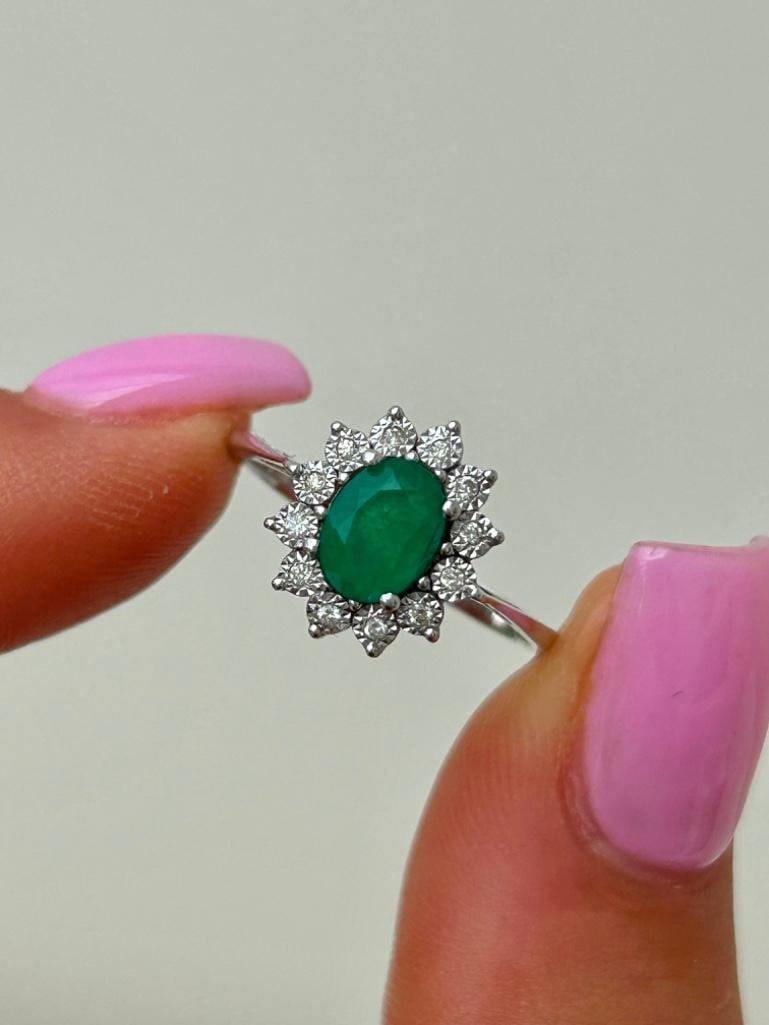 18ct White Gold Emerald and Diamond Cluster Ring: 18ct White Gold Emerald and Diamond Cluster Ring the most beautiful emerald stone surrounded by diamonds, excellent! measurements size UK O US 71/2 head of ring 12mm x 