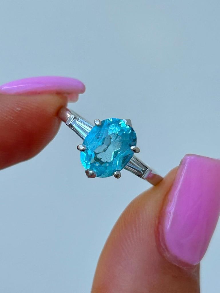 Platinum Blue Topaz and Diamond Ring: Platinum Blue Topaz and Diamond Ring beautiful blue topaz stone with diamond baguette shoulders! measurements size UK N1/2 US 7 head of ring 14mm x 10mm weight 5.07g&