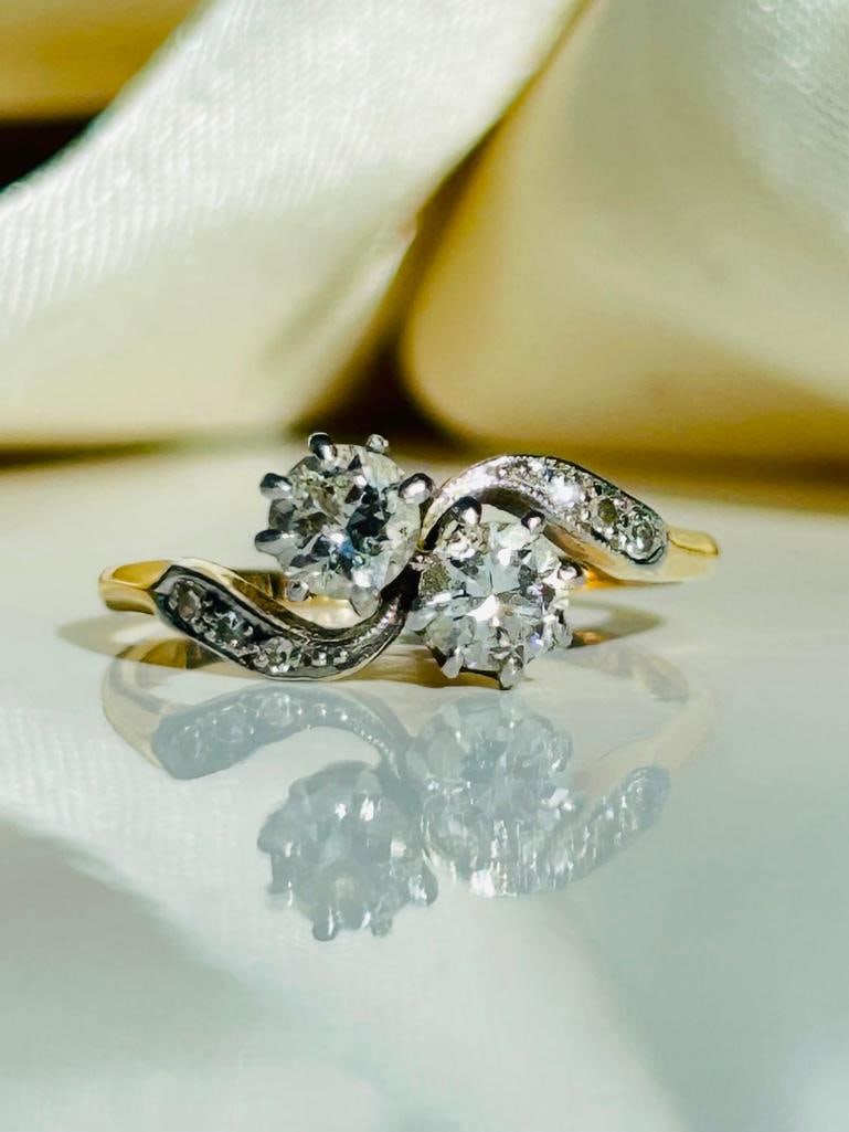 *18ct Yellow Gold x Platinum Diamond Cross Over “moi et toi” Ring: 18ct Yellow Gold x Platinum Diamond Cross Over “moi et toi” Ring total diamonds 70points with diamond shoulders truly exceptional measurements Ring Size: M 1/2 or