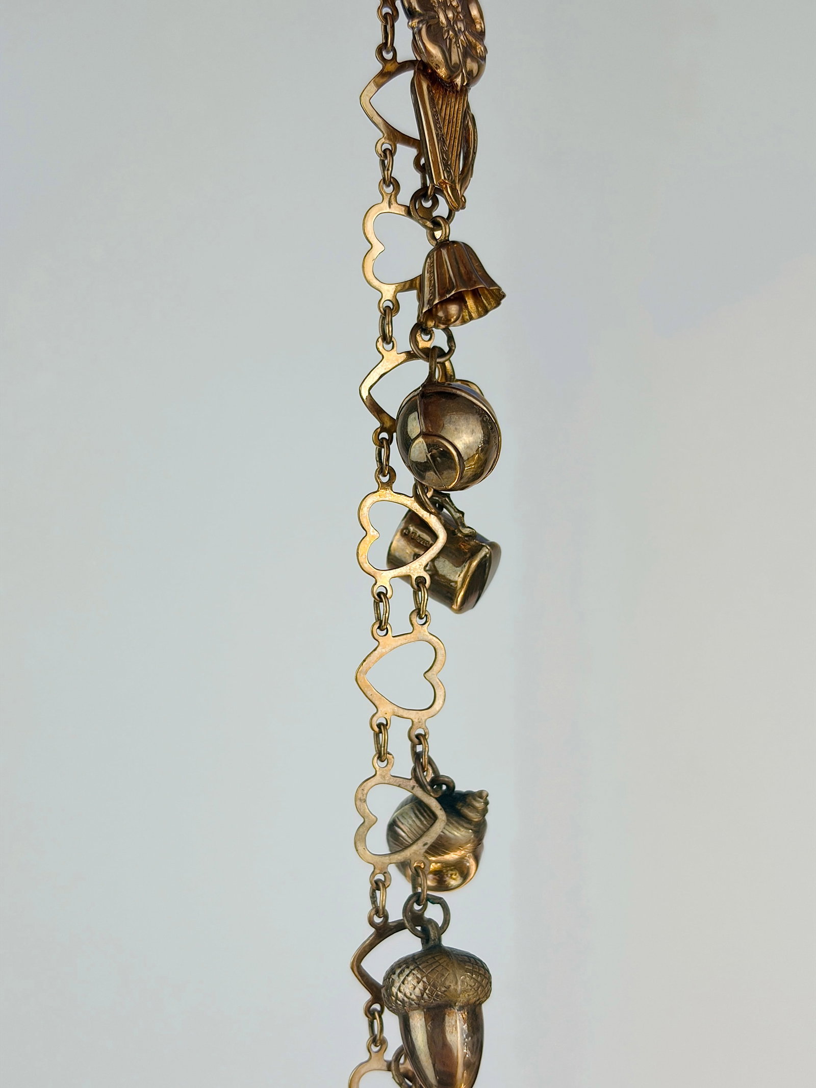 vintage hearts bracelet full of charms all in 9ct gold: vintage hearts bracelet full of charms all in 9ct gold charms include , bell / seashell / acorn / cat / harp / Tudor rose, thimble and more!