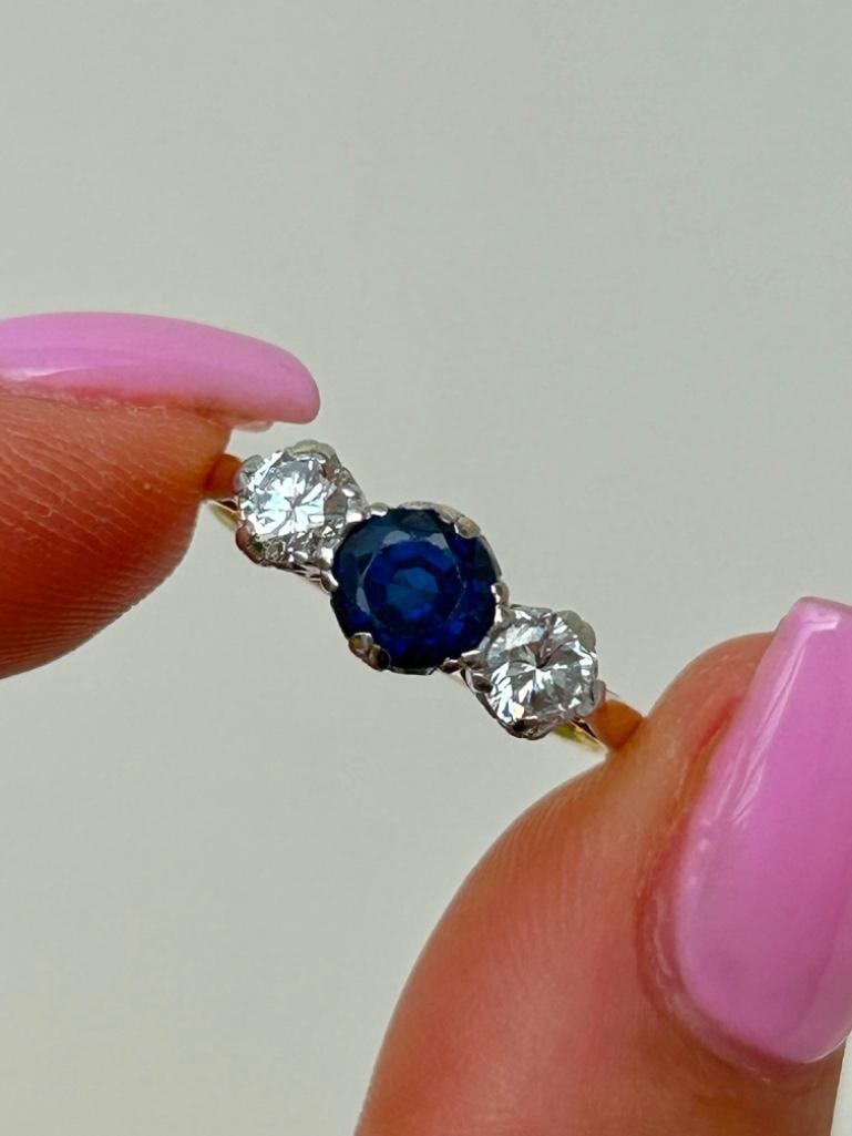 Antique Sapphire and Diamond 3 Stone Ring in 18ct Gold Designer A.M.G: Antique Sapphire and Diamond 3 Stone Ring in 18ct Gold Designer A.M.G sweetest sapphire stone next to two bright clean diamonds measurements size UK N US 7 head of ring 15mm 