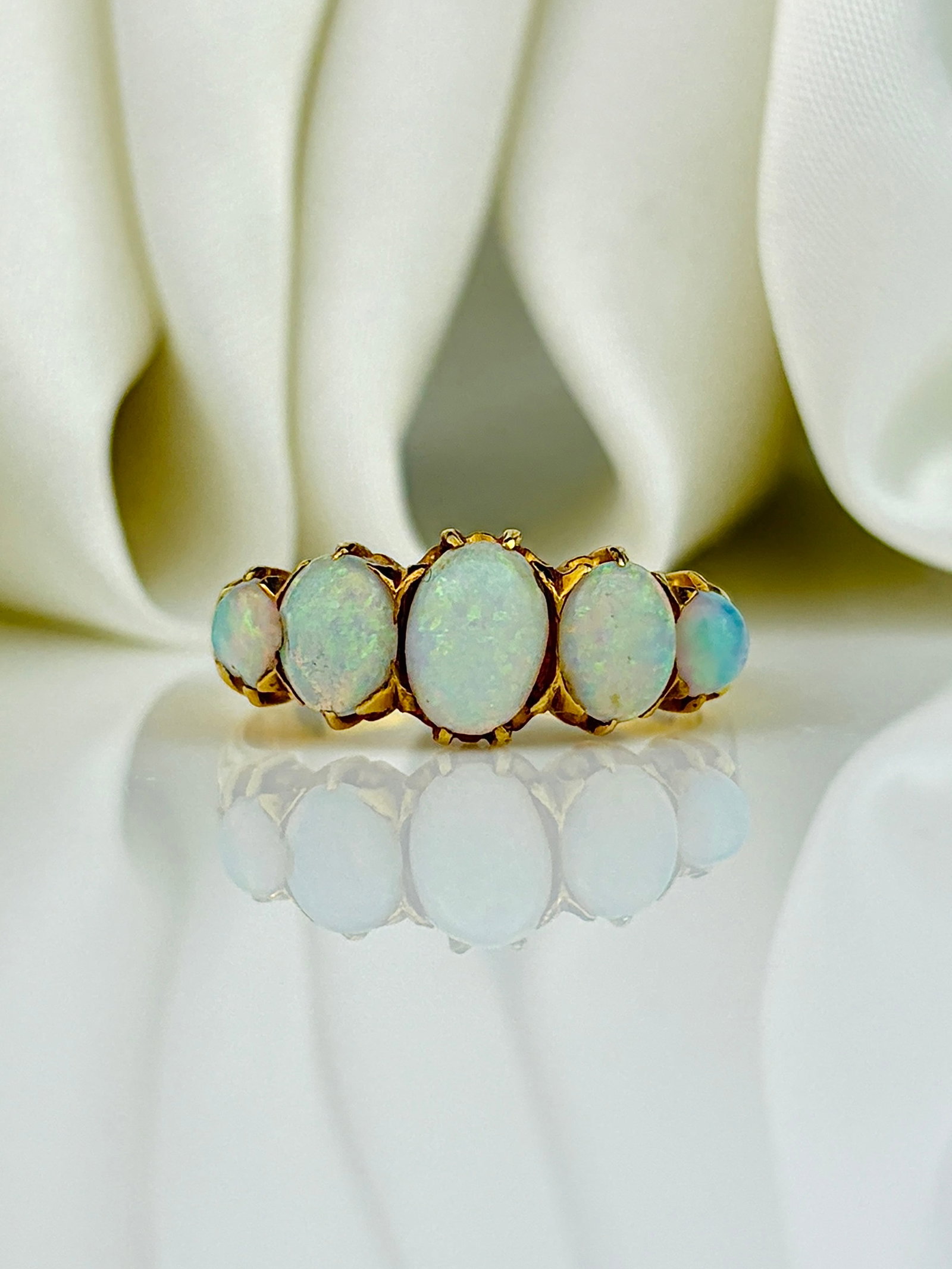Antique 18ct Yellow Gold Opal 5 Stone Ring: Antique 18ct Yellow Gold Opal 5 Stone Ring Beautiful candy opals that flash new colours with every touch of light! Weight: 4.38g Size: UK N1/2, US 7.25, Width 7mm, Height off finger 4mm Materials:
