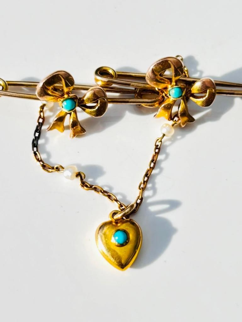 Mappin Brothers Victorian Turquoise and Pearl 9 Carat Gold Brooch: Mappin Brothers Victorian Turquoise and Pearl 9 Carat Gold Brooch This fancy Mapin Brothers Victorian brooch holds a scattering of small bright turquoise stones and pearls. The two pins 