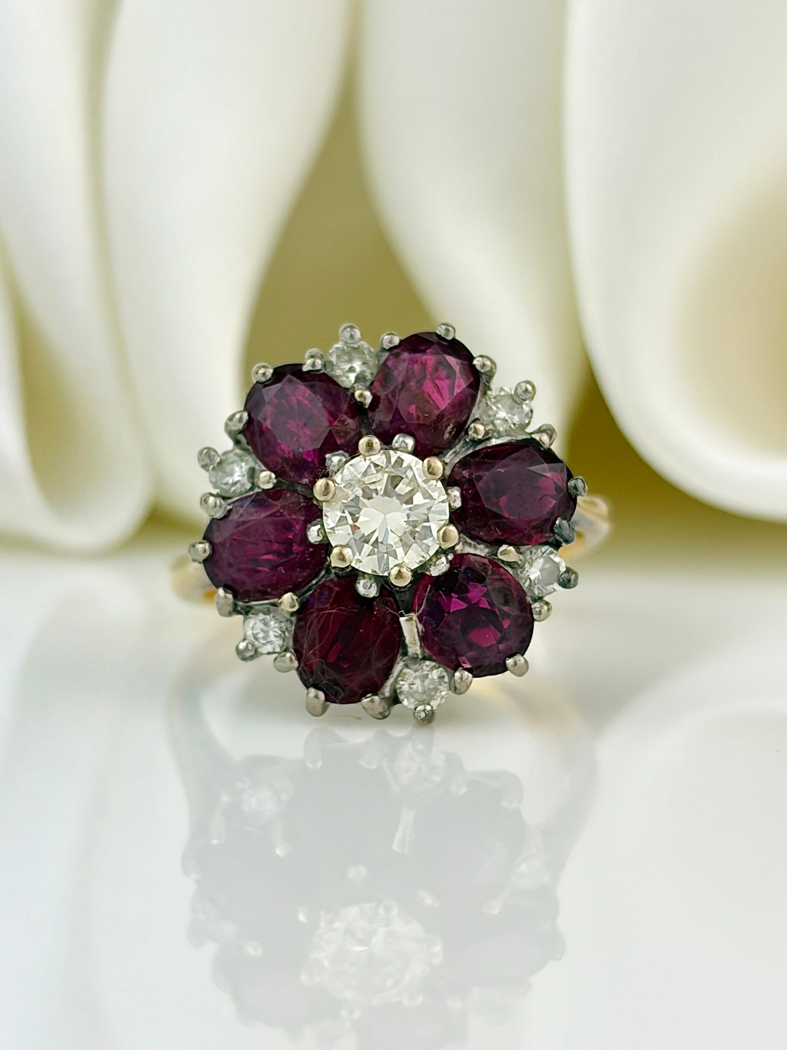chunky 18ct yellow gold ruby and diamond cluster / flower ring: chunky 18ct yellow gold ruby and diamond cluster / flower ring Weight: 4.75g Size: UK I1/2, US 5, face of ring 14x14mm, Height off finger 8mm Materials: 18ct gold Hallmarks: London, 18ct, Makers Mark