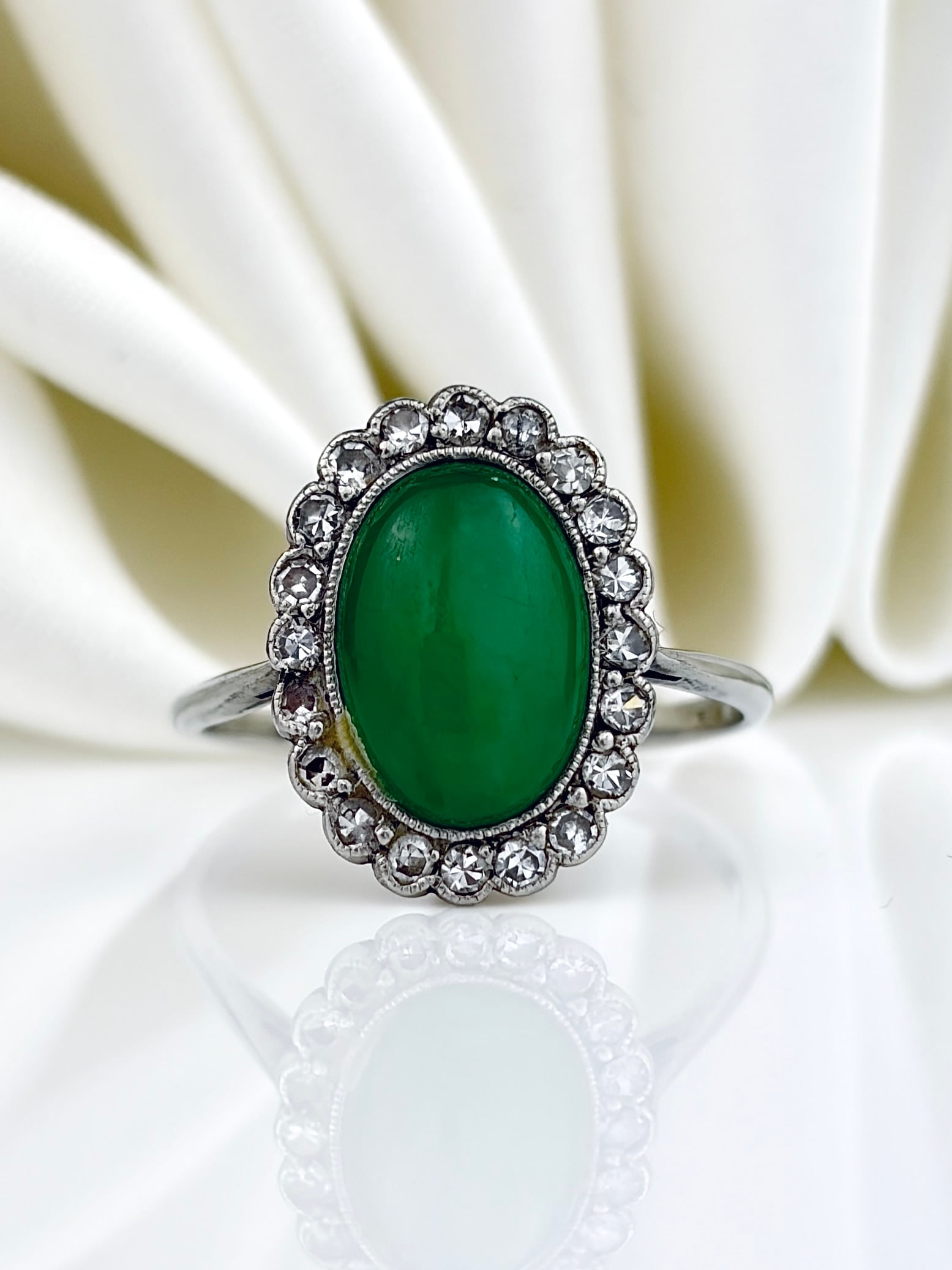 ANTIQUE ART DECO PLATINUM CABOCHON JADE AND DIAMOND CLUSTER RING: ANTIQUE ART DECO PLATINUM CABOCHON JADE AND DIAMOND CLUSTER RING A truly incredible piece from the art deco era!