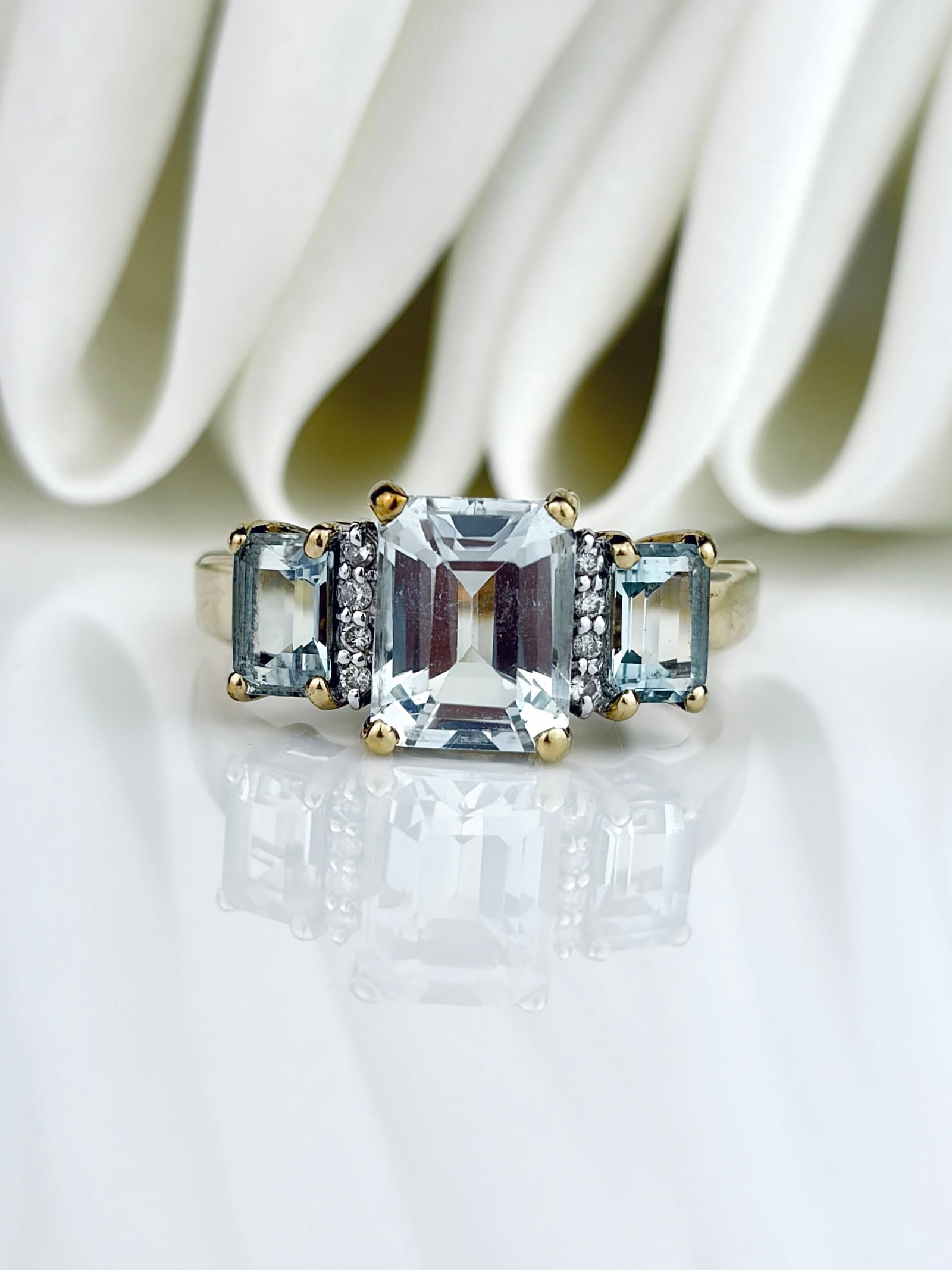 Large Size Vintage 9ct Yellow Gold Emerald Cut Aquamarine and Diamond 3 Stone Ring: Vintage 9ct Yellow Gold Emerald Cut Aquamarine and Diamond 3 Stone Ring Beautiful ring featuring three emerald cut aquamarines, separated by four small diamonds!