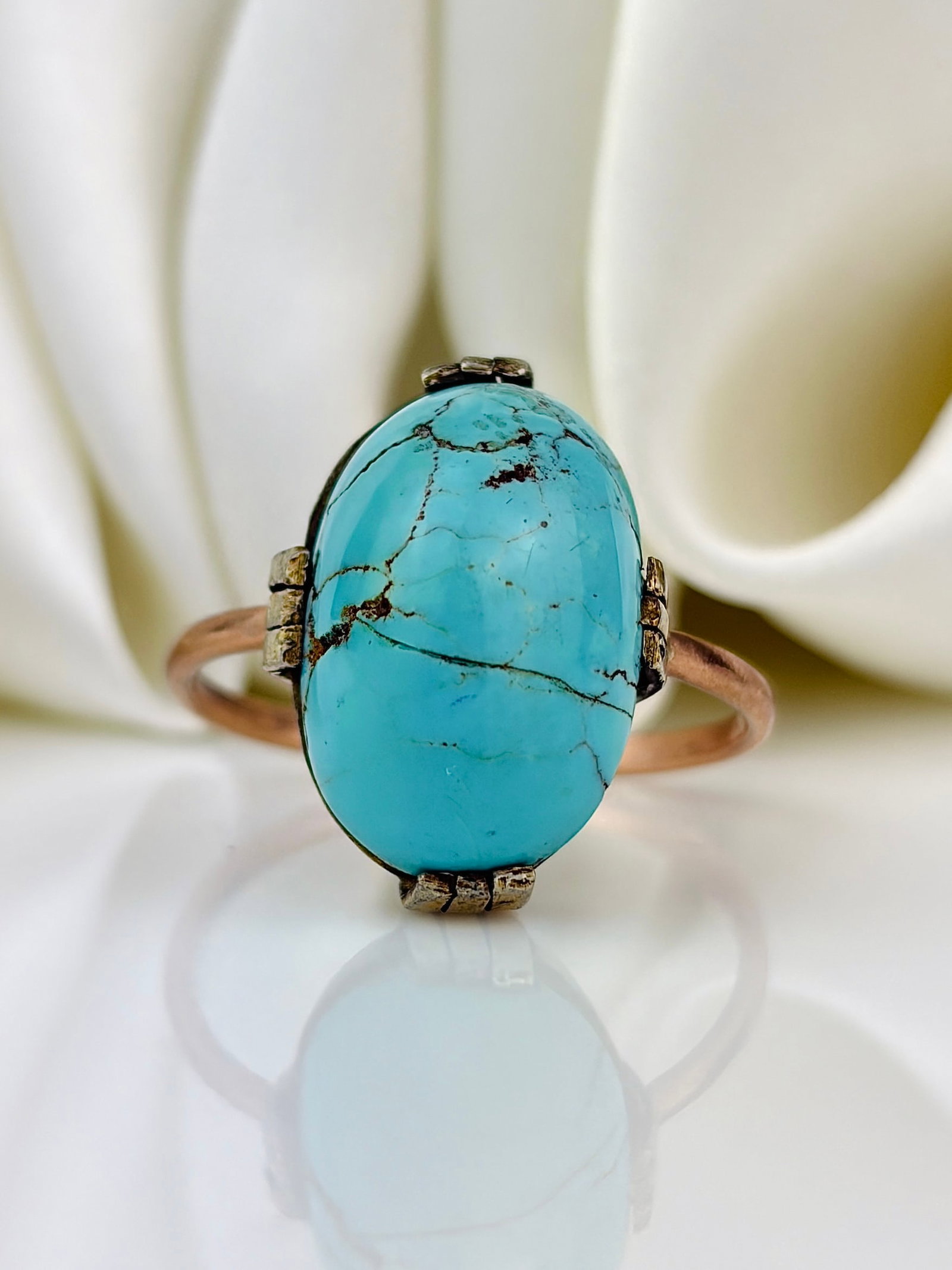 Antique gold and silver set matrix turquoise ring: Antique gold and silver set matrix turquoise ring Weight: 5.45g Size: UK S, US 9.5, Face of ring 19x13mm, Height off finger 10mm Materials: Gold and silver Hallmarks: None present 